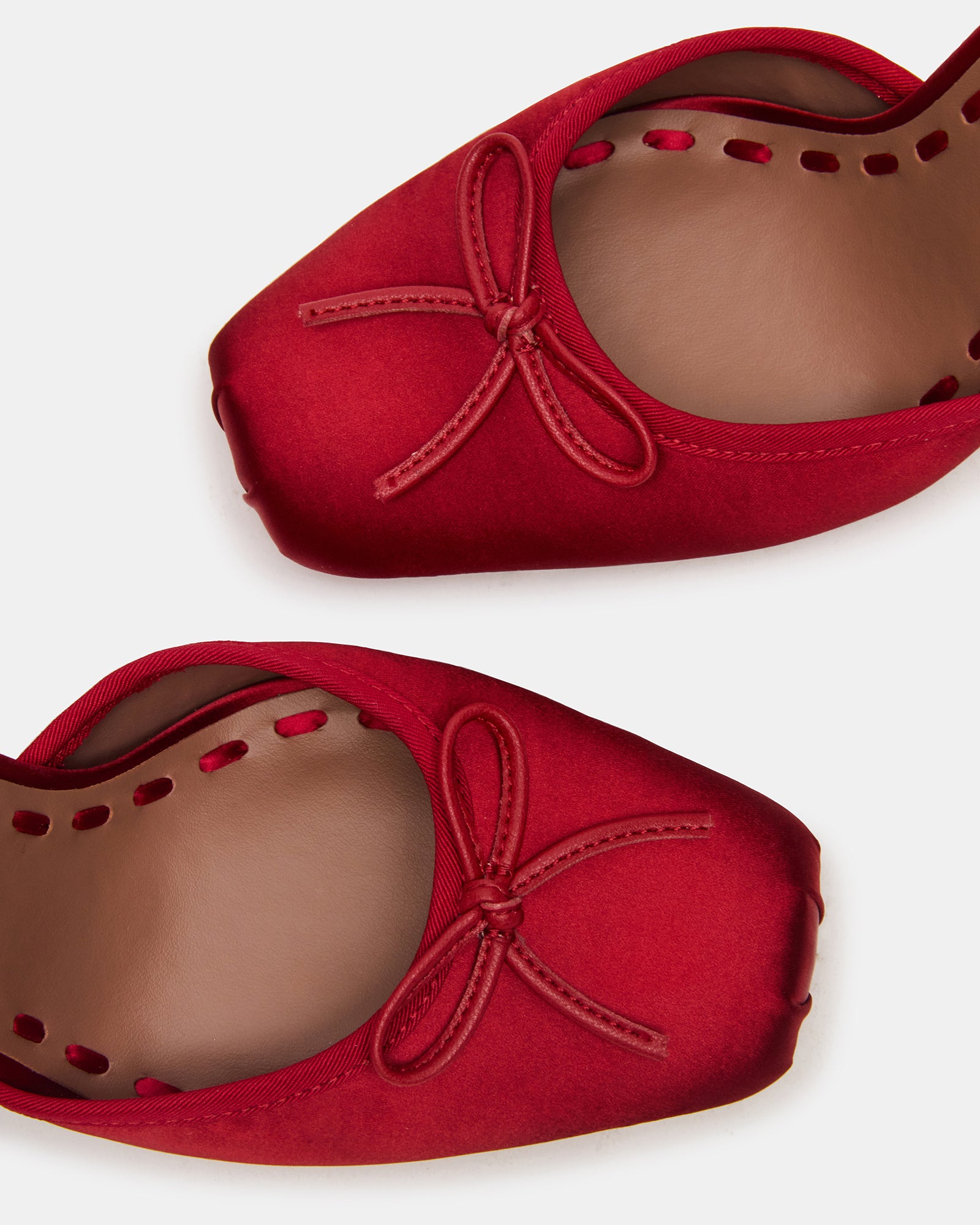 Close-up of Larina red satin lace-up heels showcasing the square-toe design.
