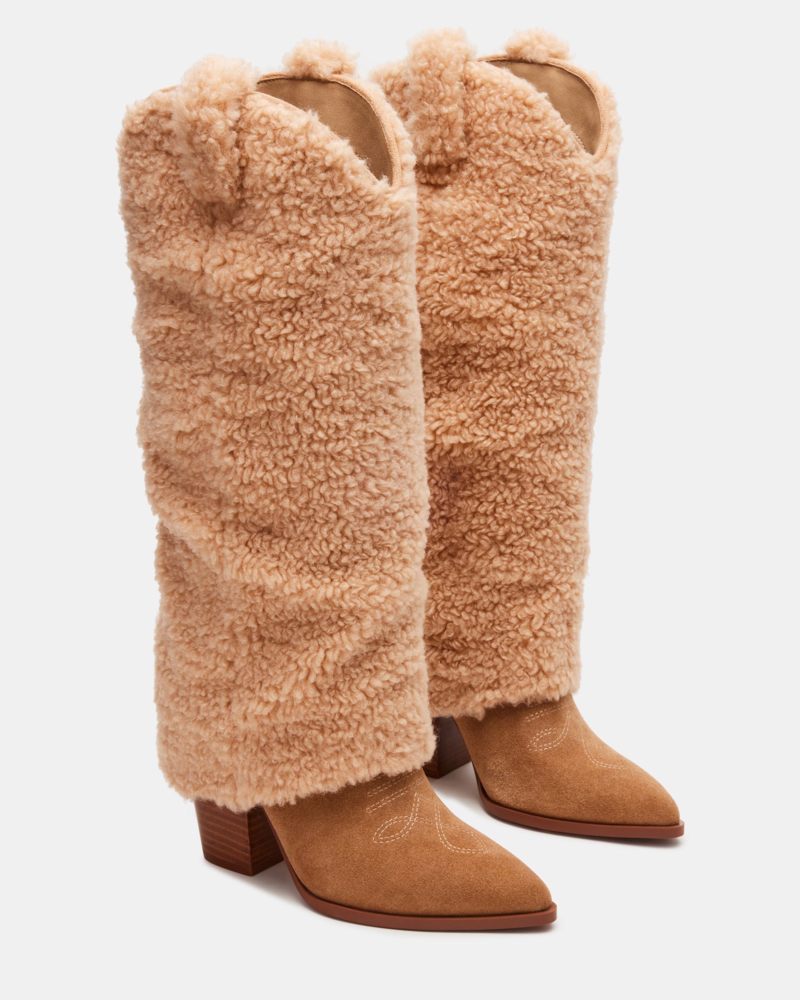 Model wearing wide calf knee high boots with jeans during a Florida fall day