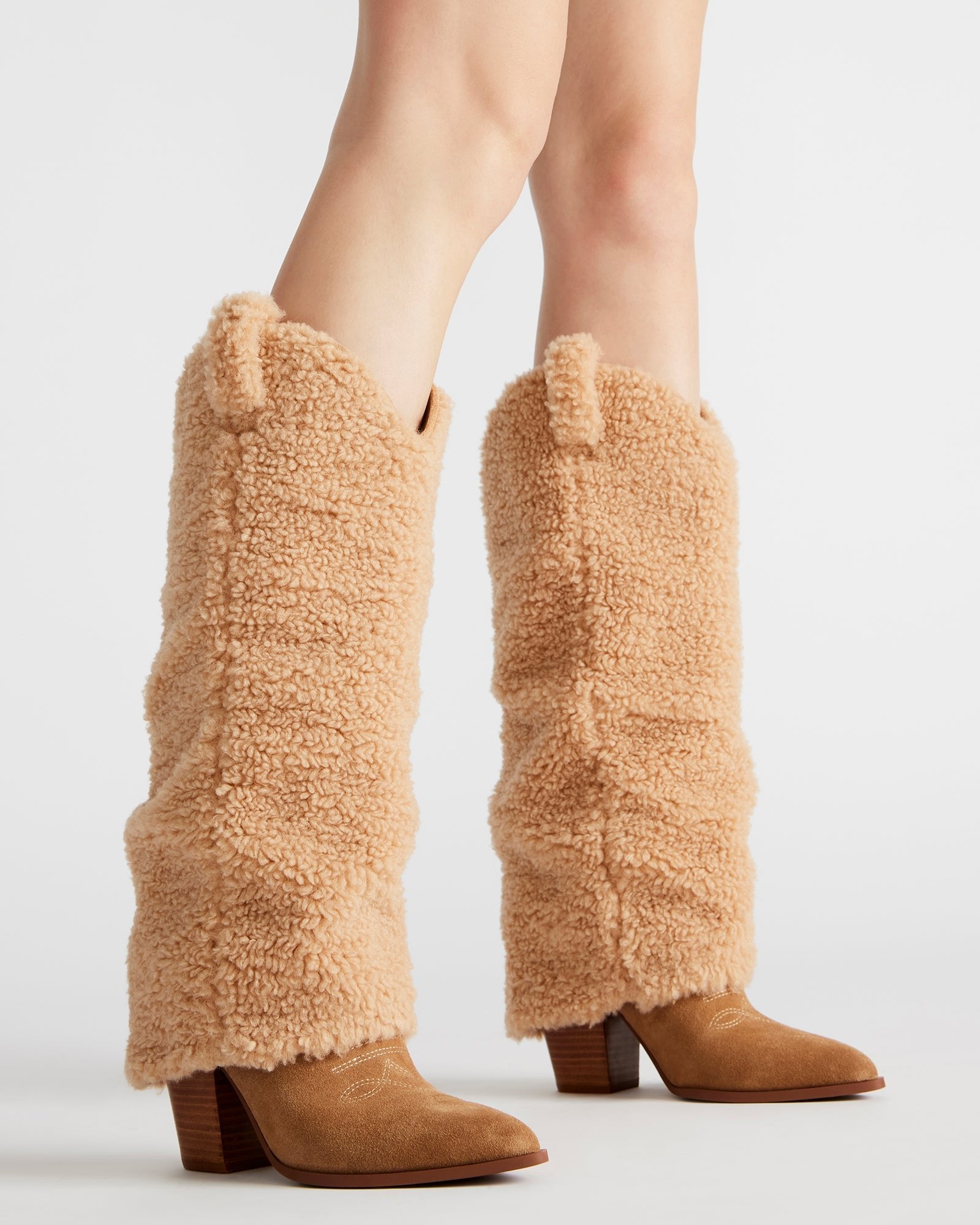 Close-up of decorative stitching on western style boots with point toe