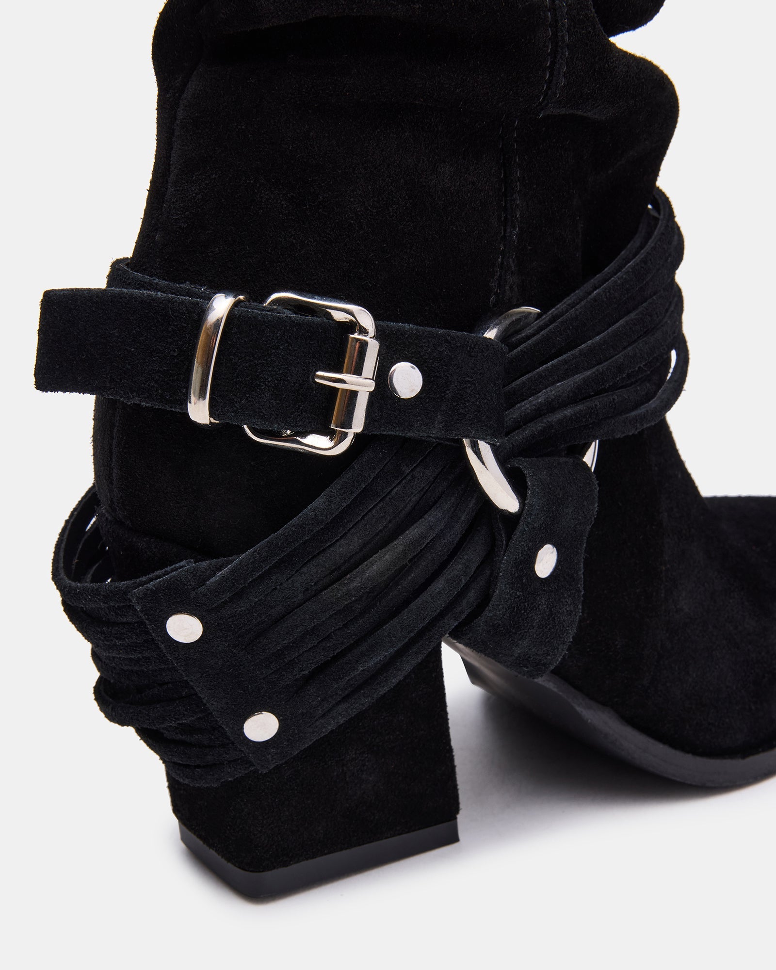 Lauper pointed toe ankle booties styled with a chic dress for a fashionable look.