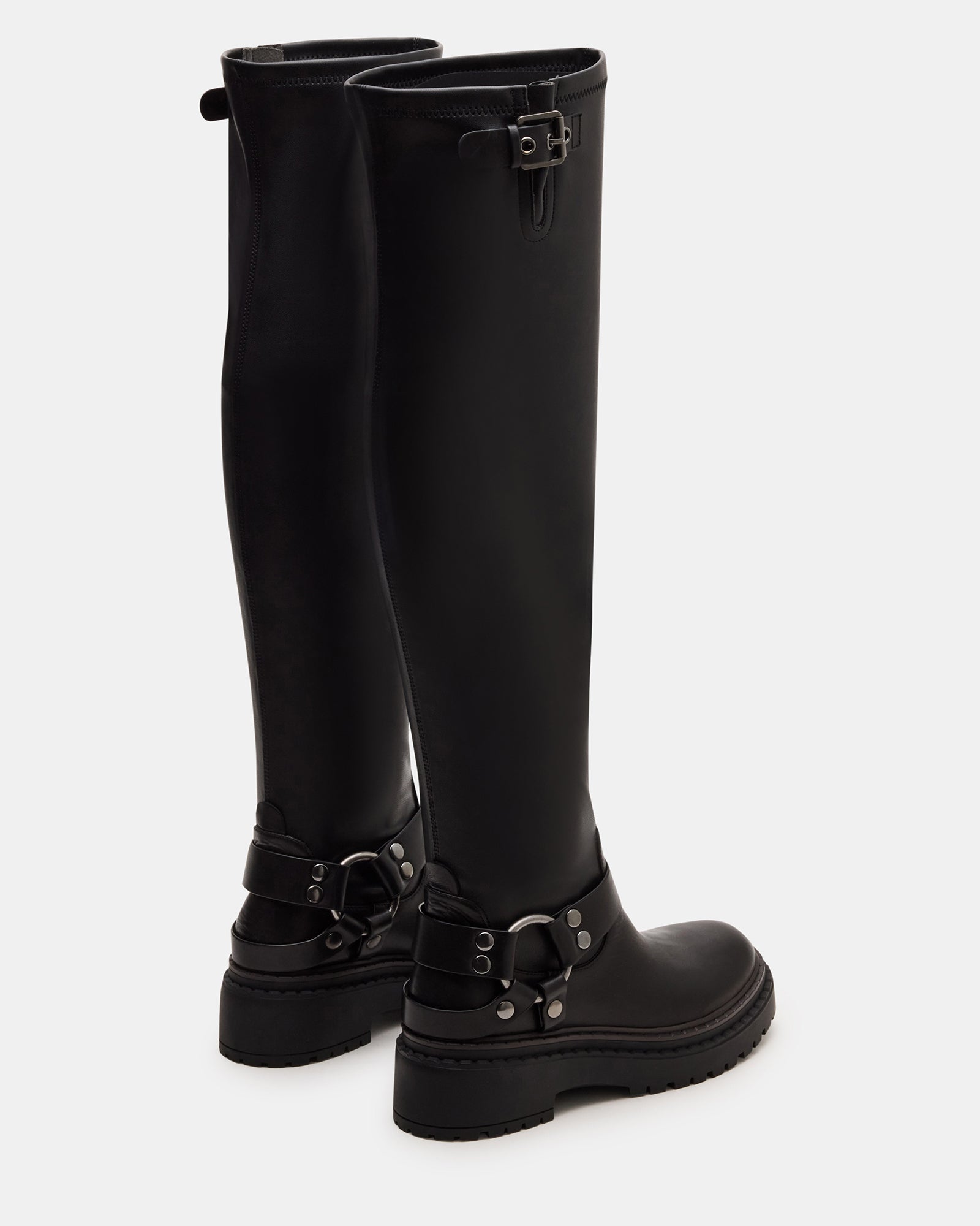 Close-up of moto boots buckle detail with textured vegan leather finish