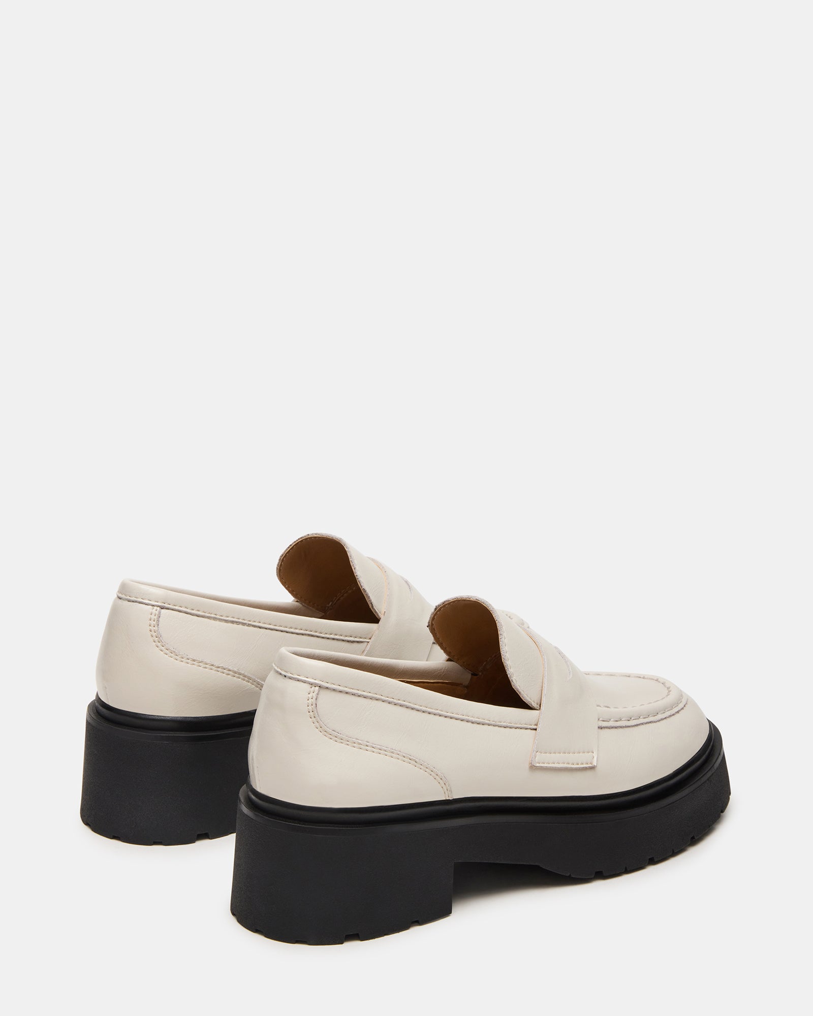 Brown leather loafers styled with rolled jeans for a casual look