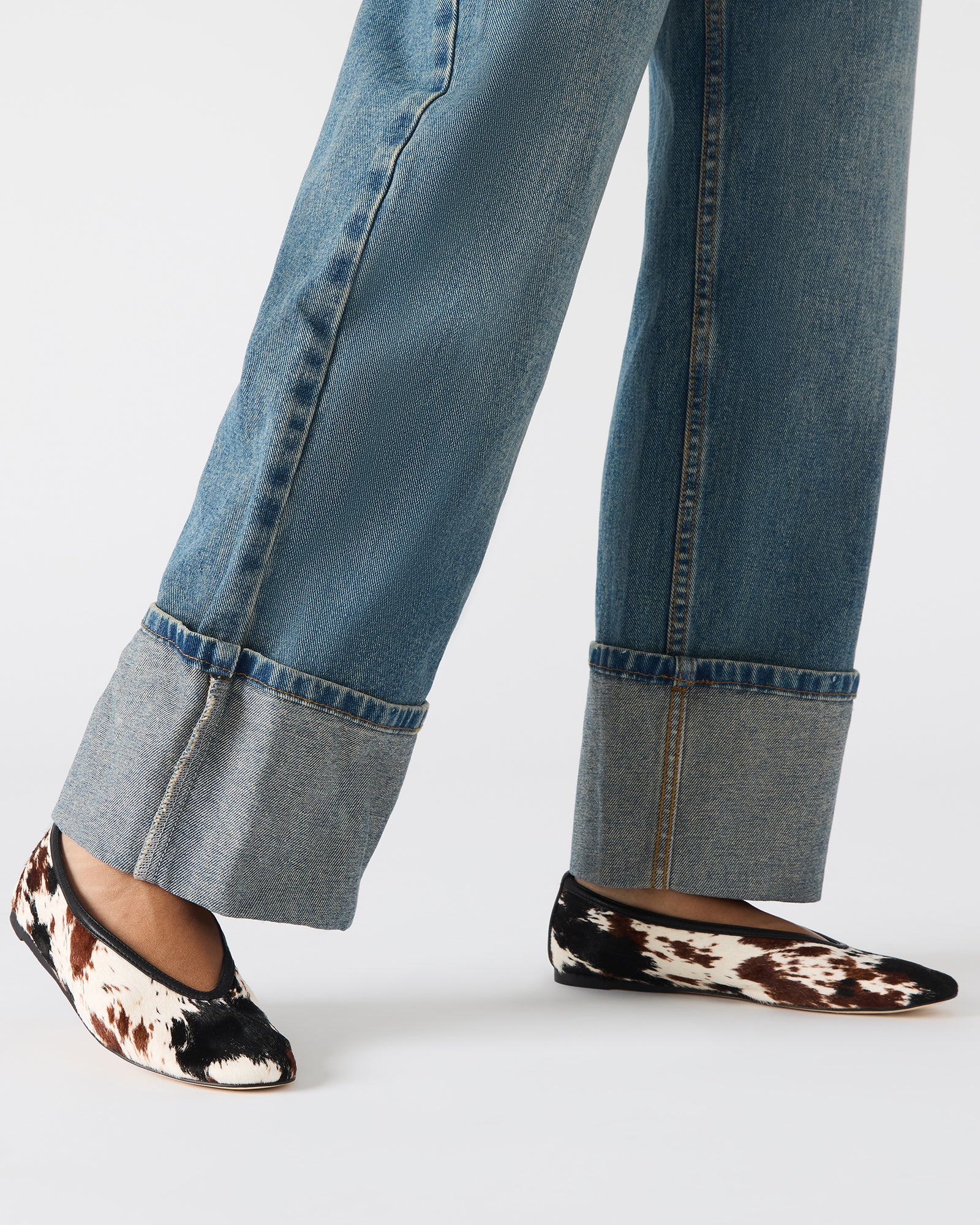 Side angle showing black square toe ballet flats with leather upper and subtle heel