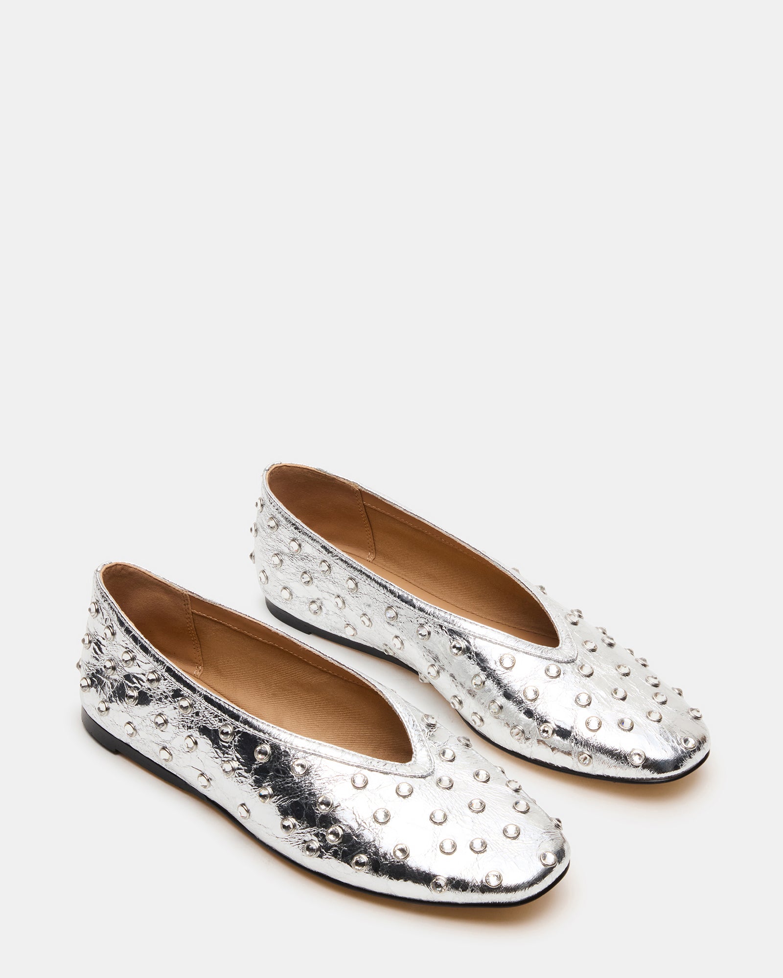 Side view of silver ballet flats perfect for casual outings.