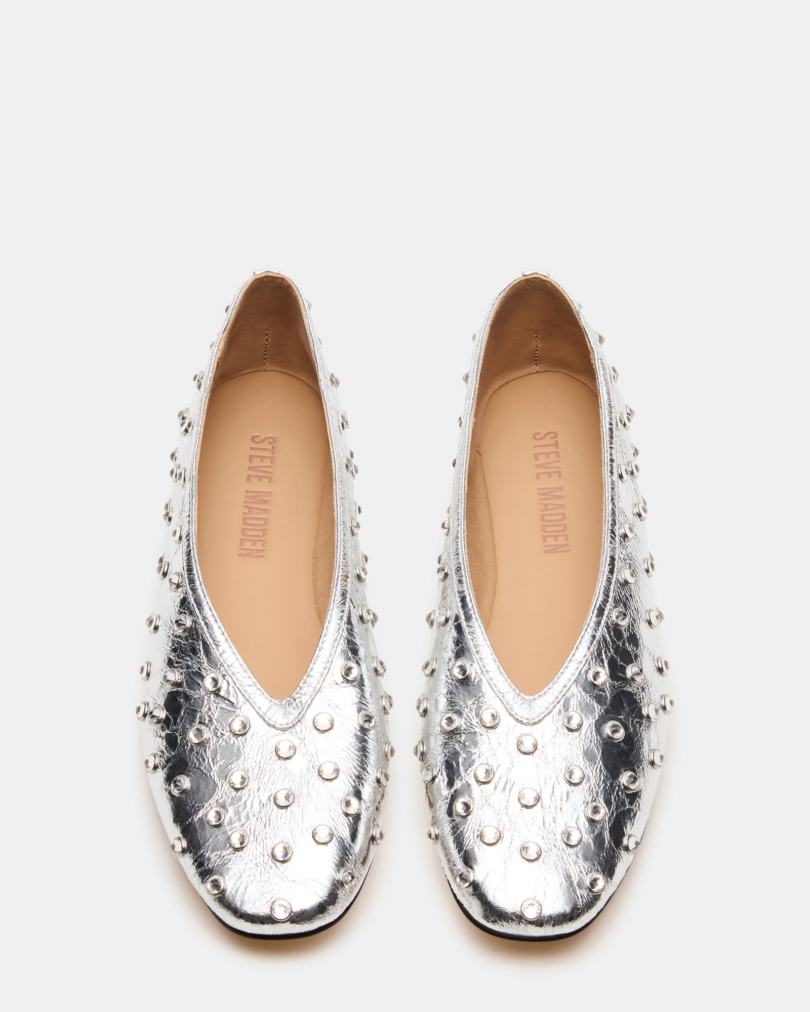 Close-up of flat back rhinestones on stylish ballet flats.