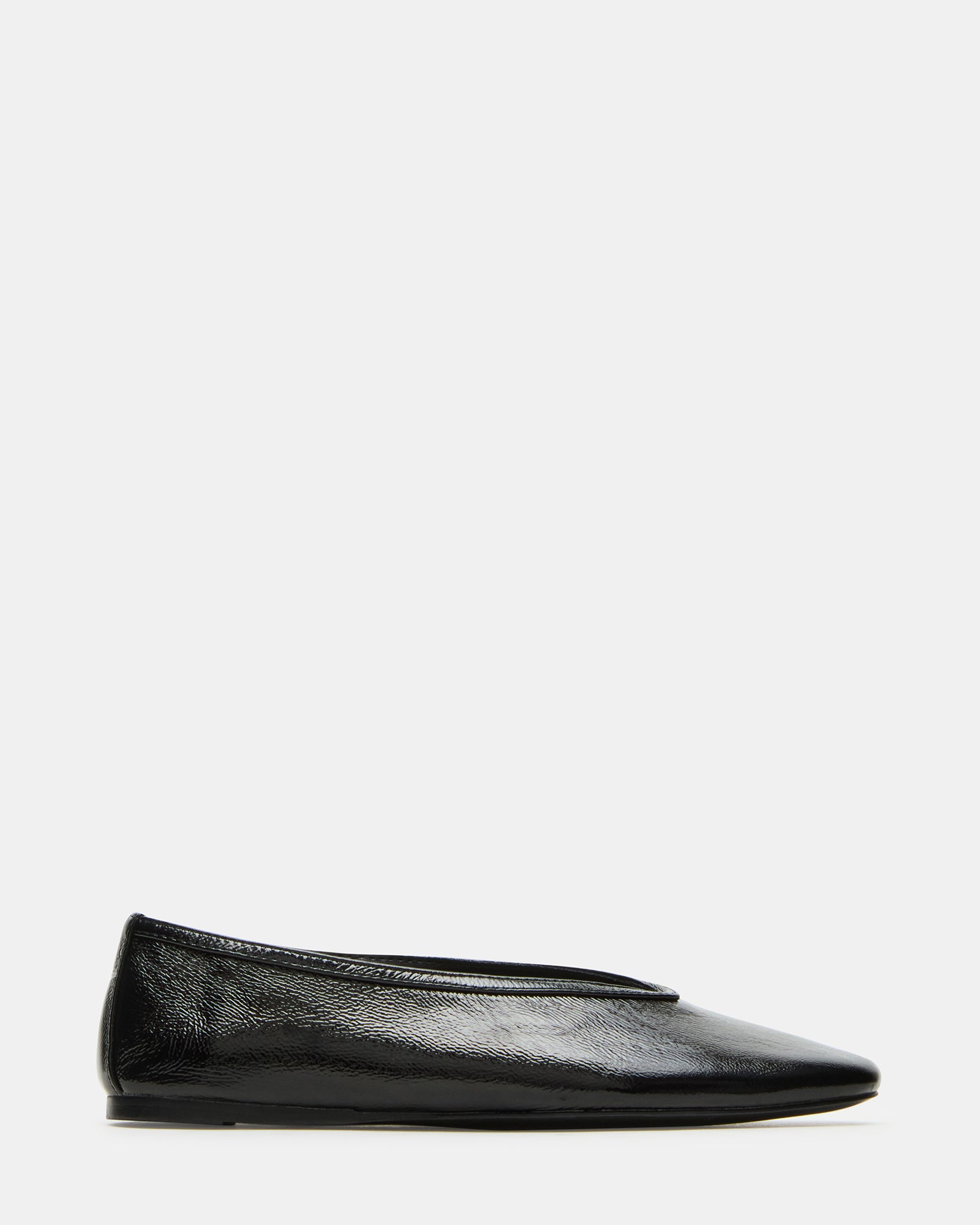 Side view of black ballet flats with sleek square toe