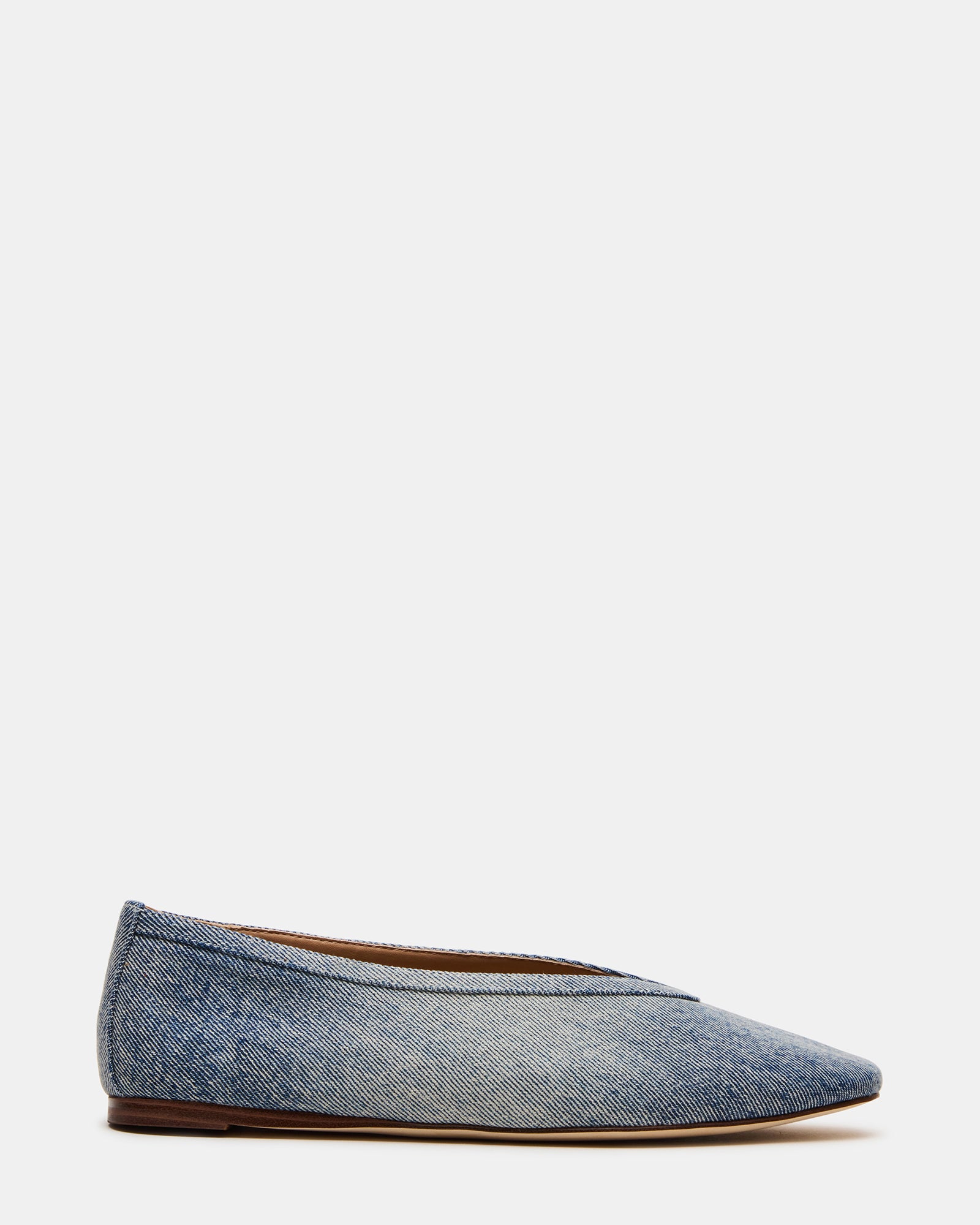 Side view of LENI denim square toe ballet flats on a woman's feet, showcasing their modern silhouette