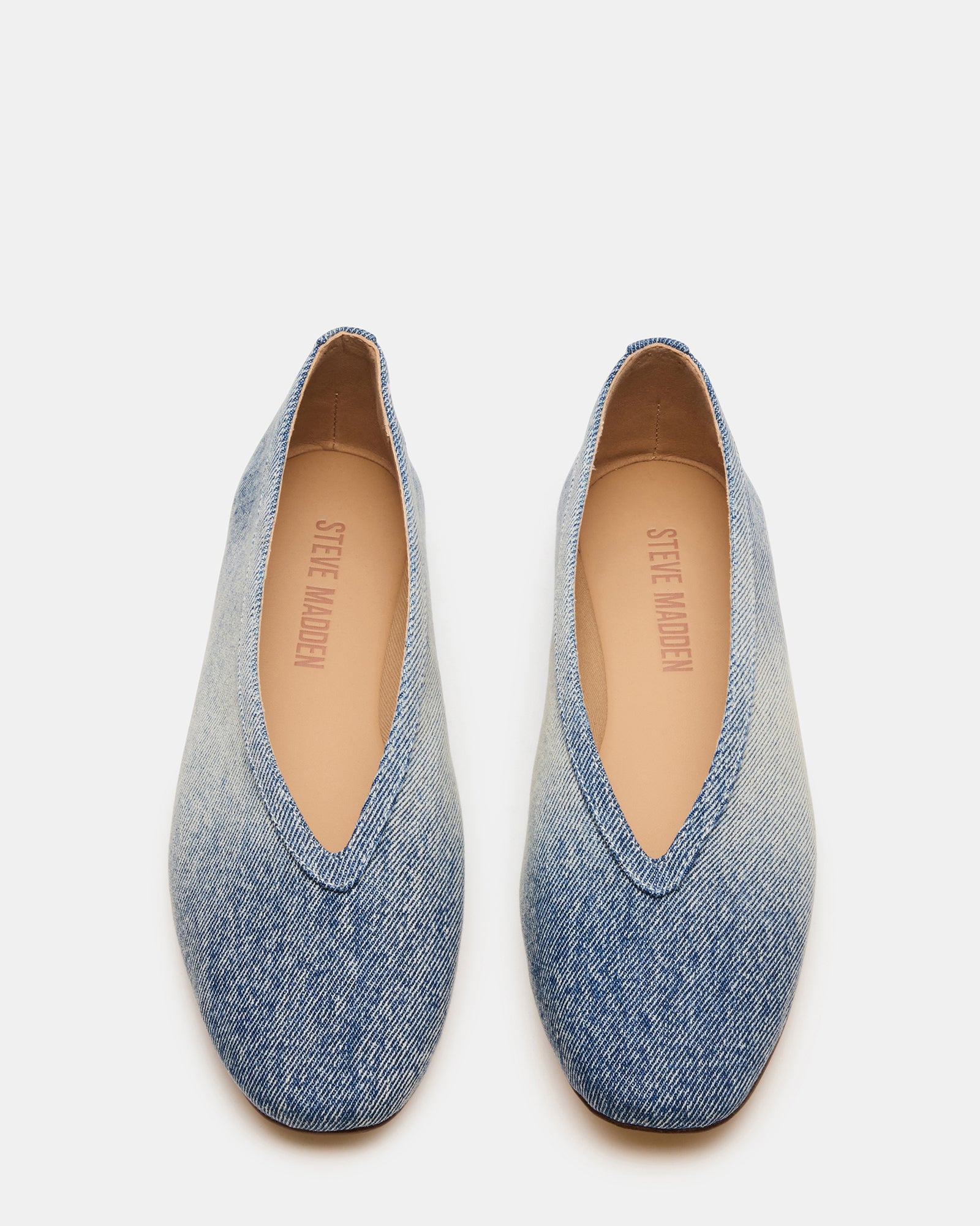 Side view of LENI denim square toe ballet flats on a womans feet, showcasing their modern silhouette