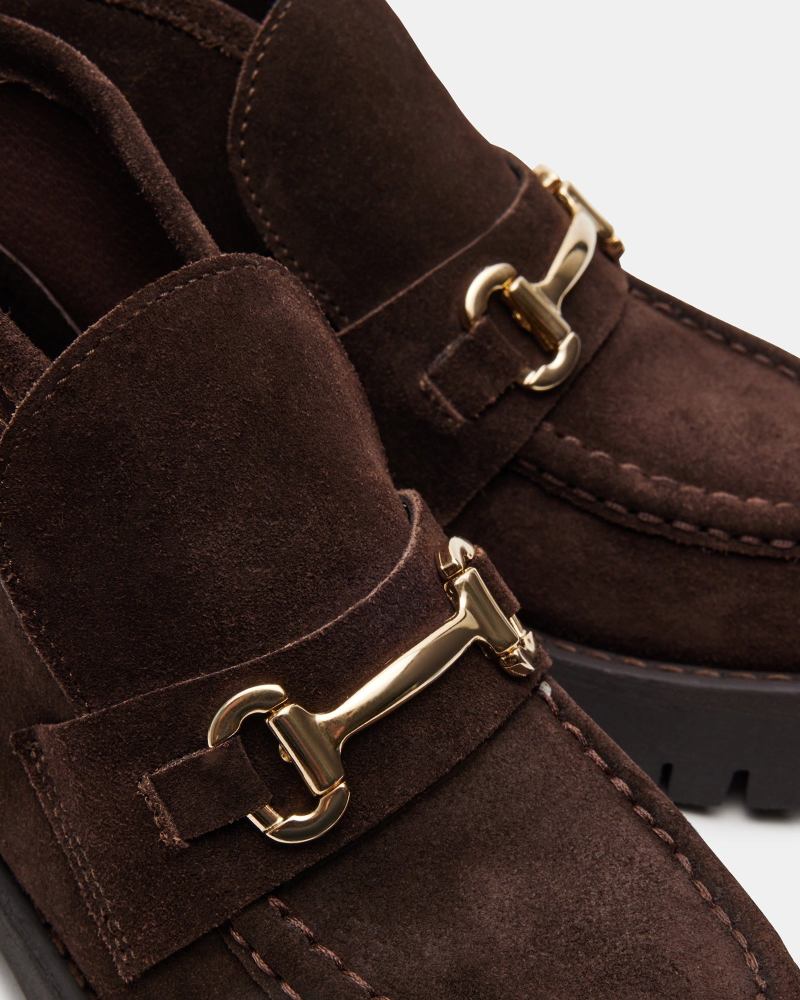 Top view of chocolate suede loafers for men with platform sole and horsebit accent.