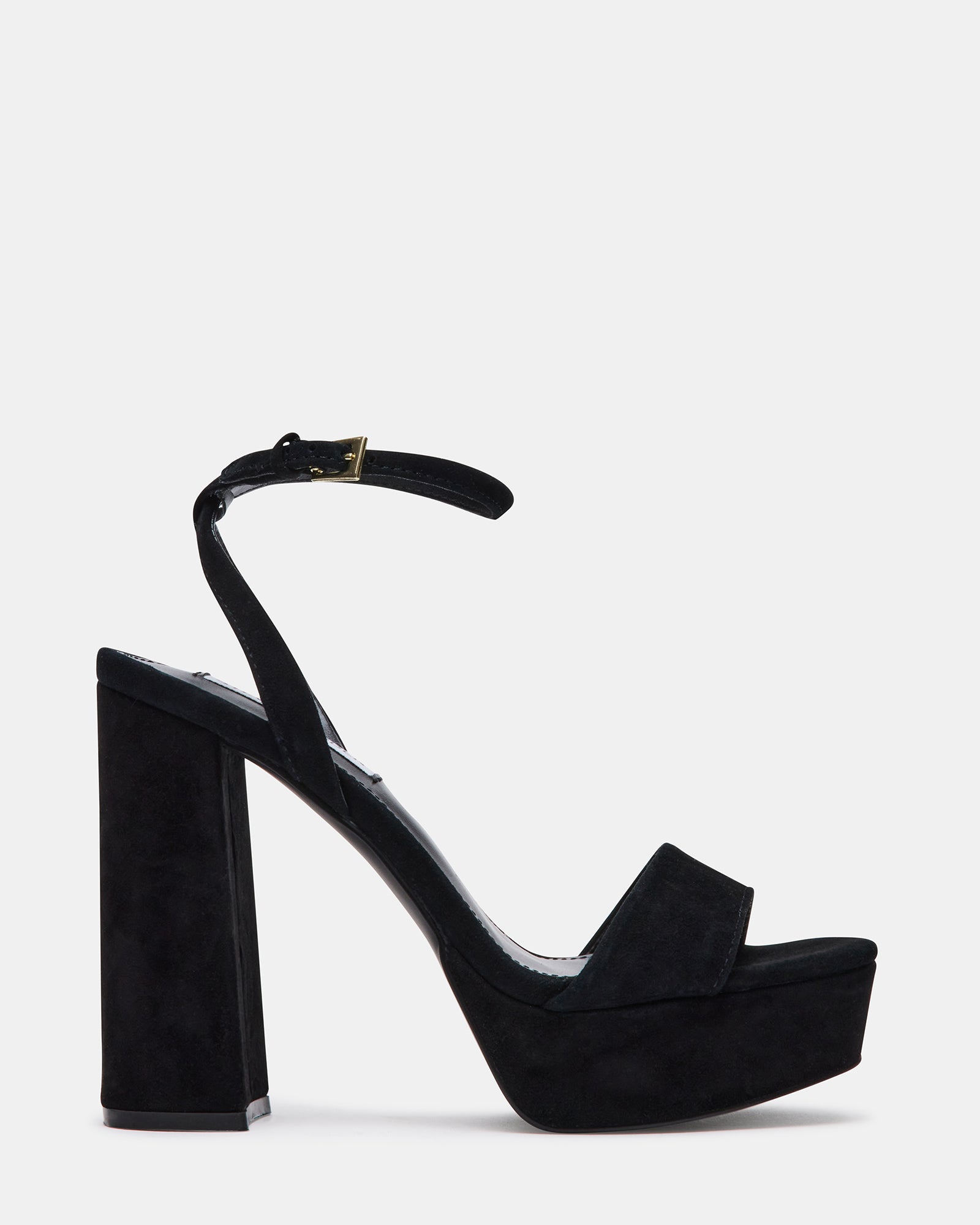 Side view of black platform sandals paired with a cocktail dress