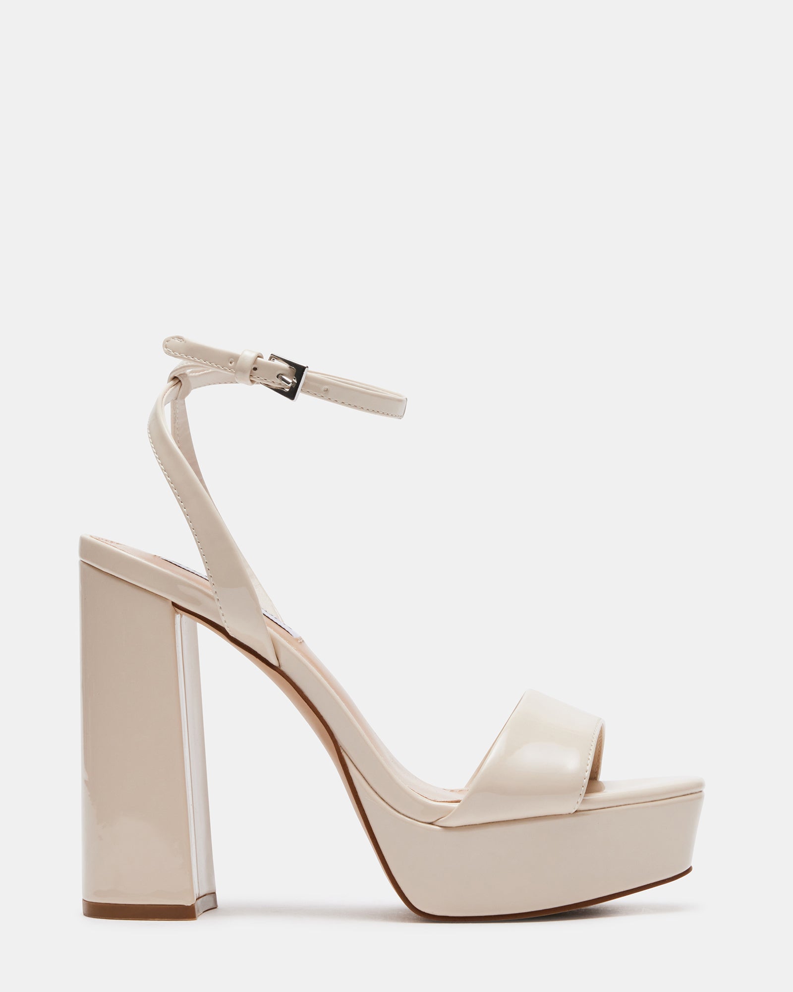 Close-up of Lessa patent platform sandals highlighting the ankle strap design.