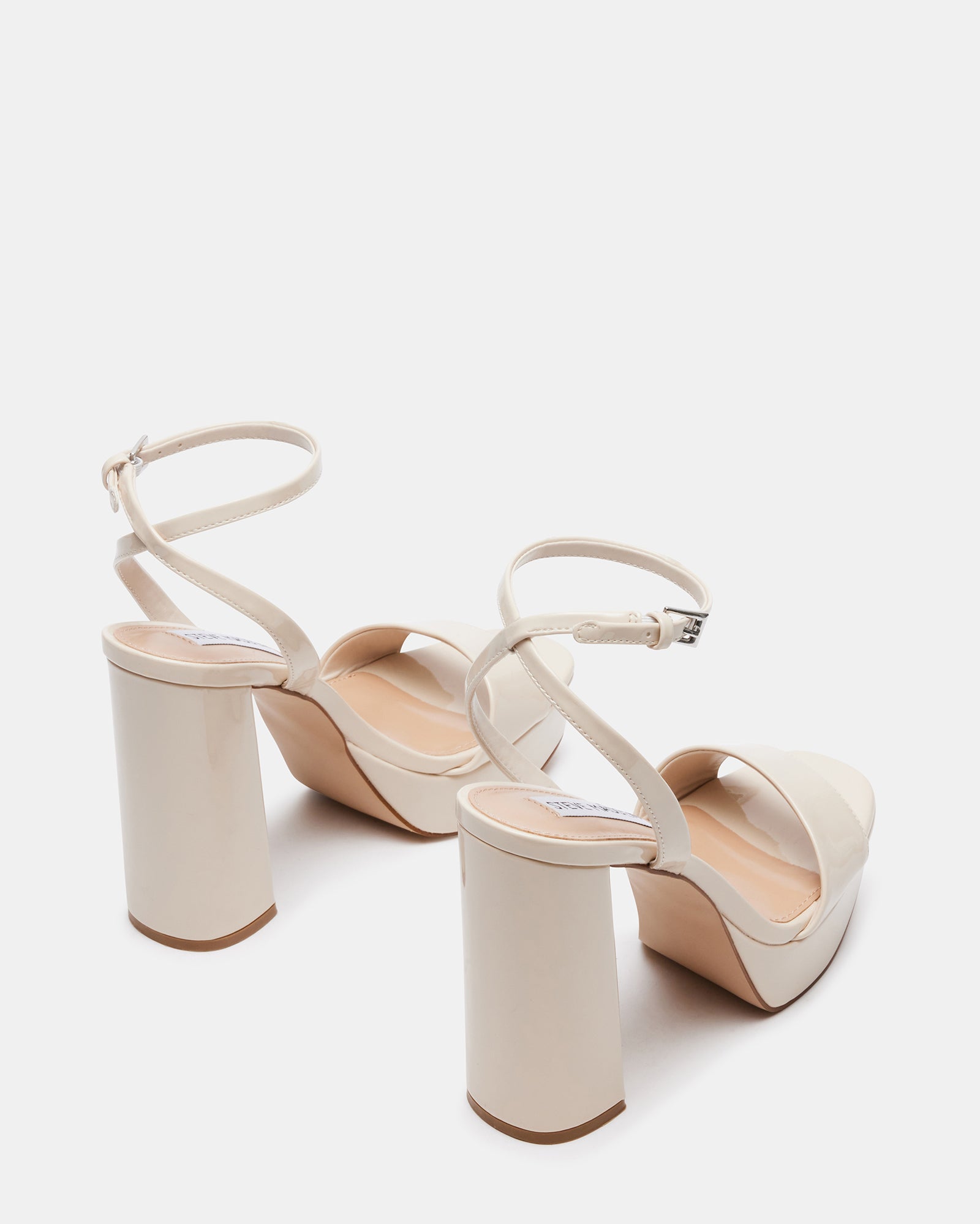 Lessa platform sandals worn with a formal dress, perfect for evening events.