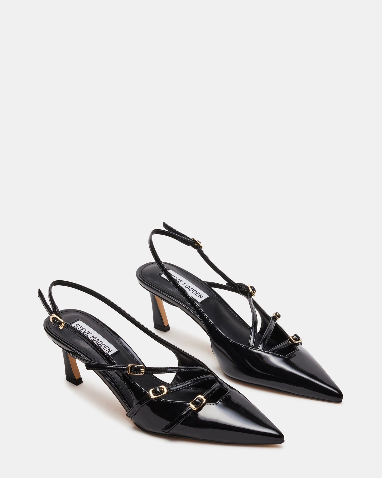 Slingback high heel shoes styled with professional outfit on pavement