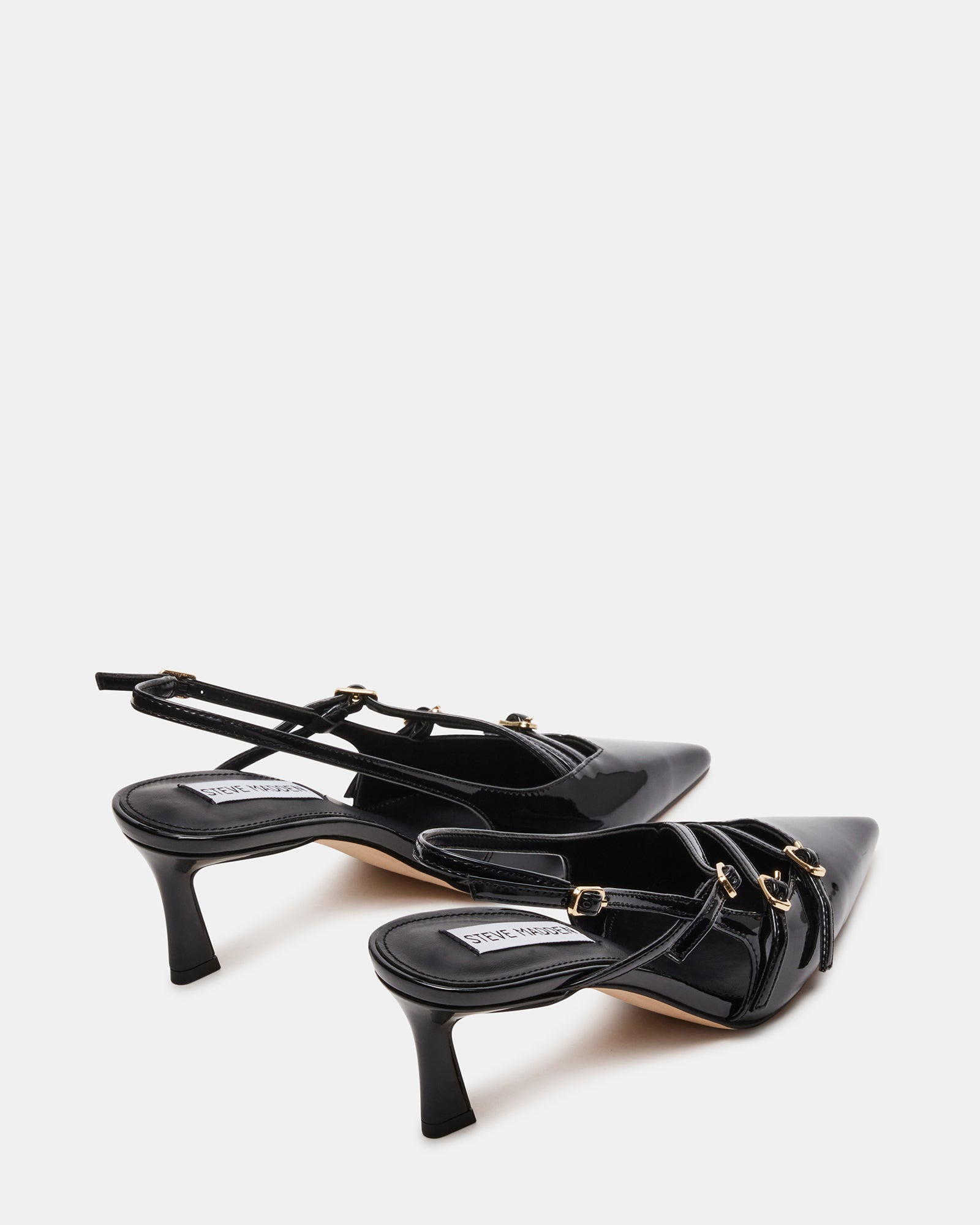 Slingback high heel shoes styled with professional outfit on pavement