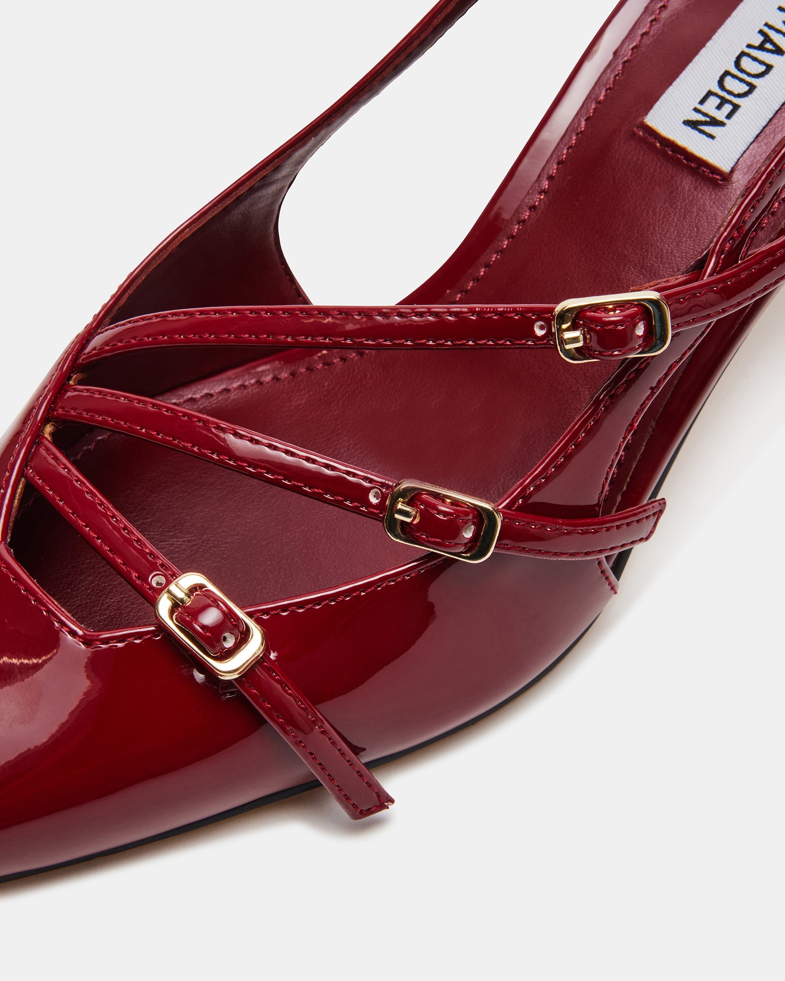 Side view of Liana wine patent slingback heels highlighting pointed toe and patent shine