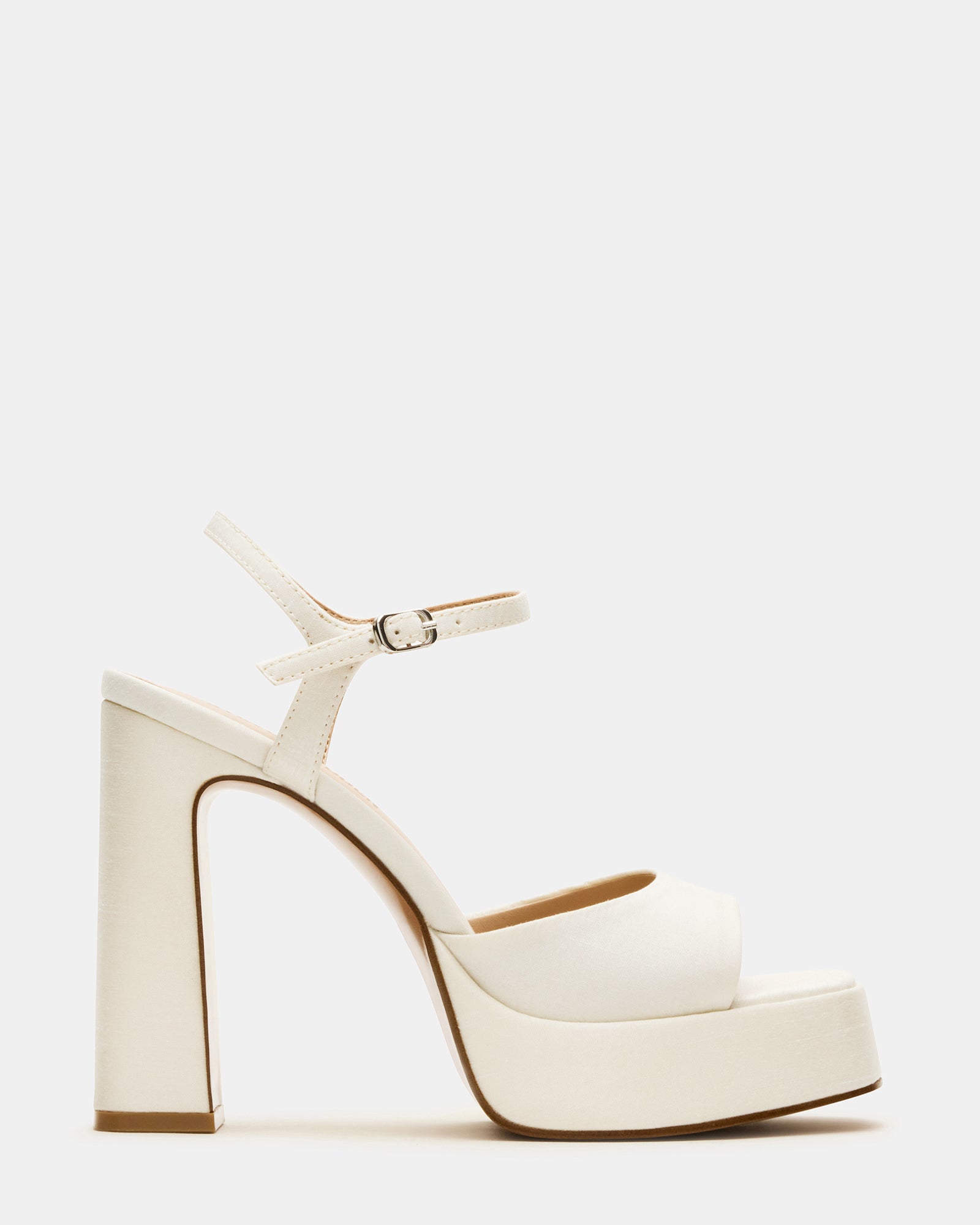 Close-up of ivory satin platform block heels showcasing the square toe design.