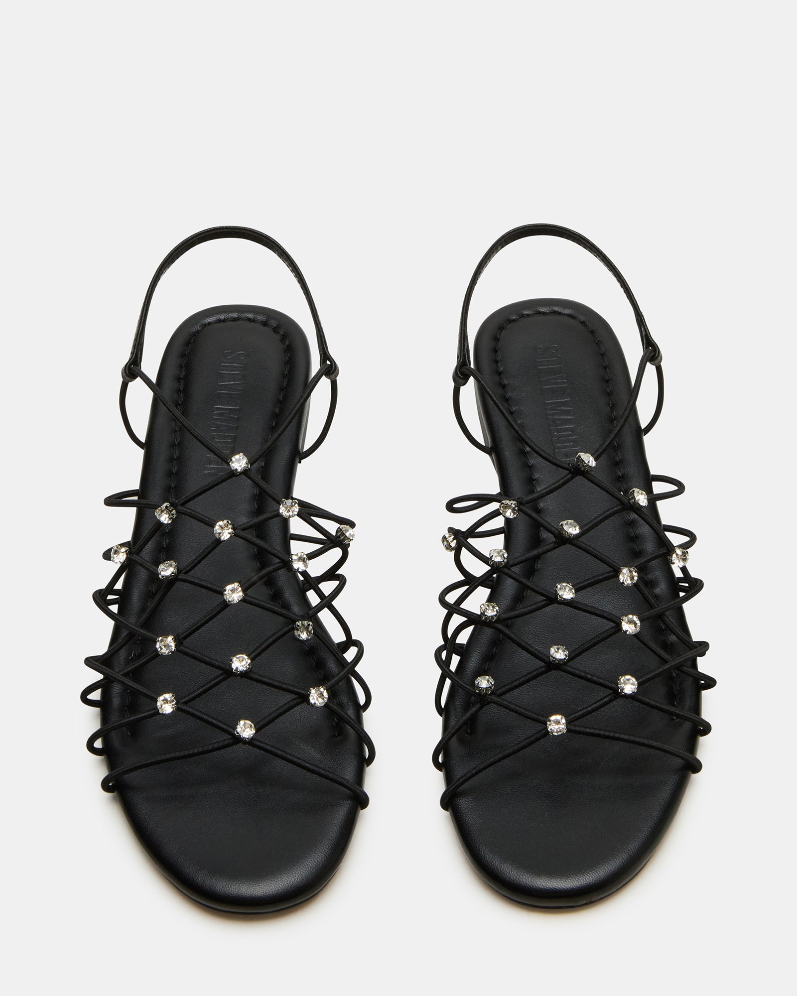 Close-up of Libra black strappy sandals showcasing rhinestone details.
