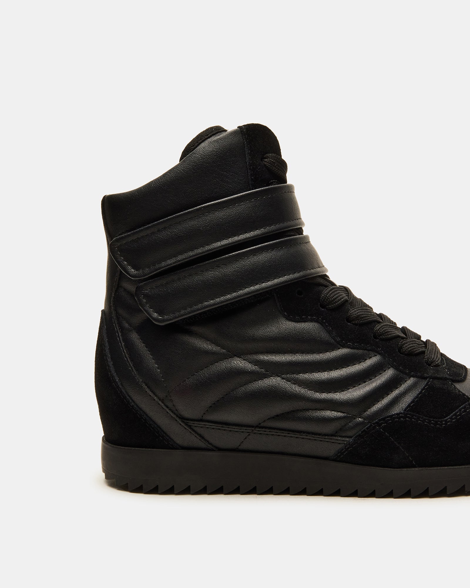 Close-up of the textured sole and leather upper of LIFTOFF sneakers