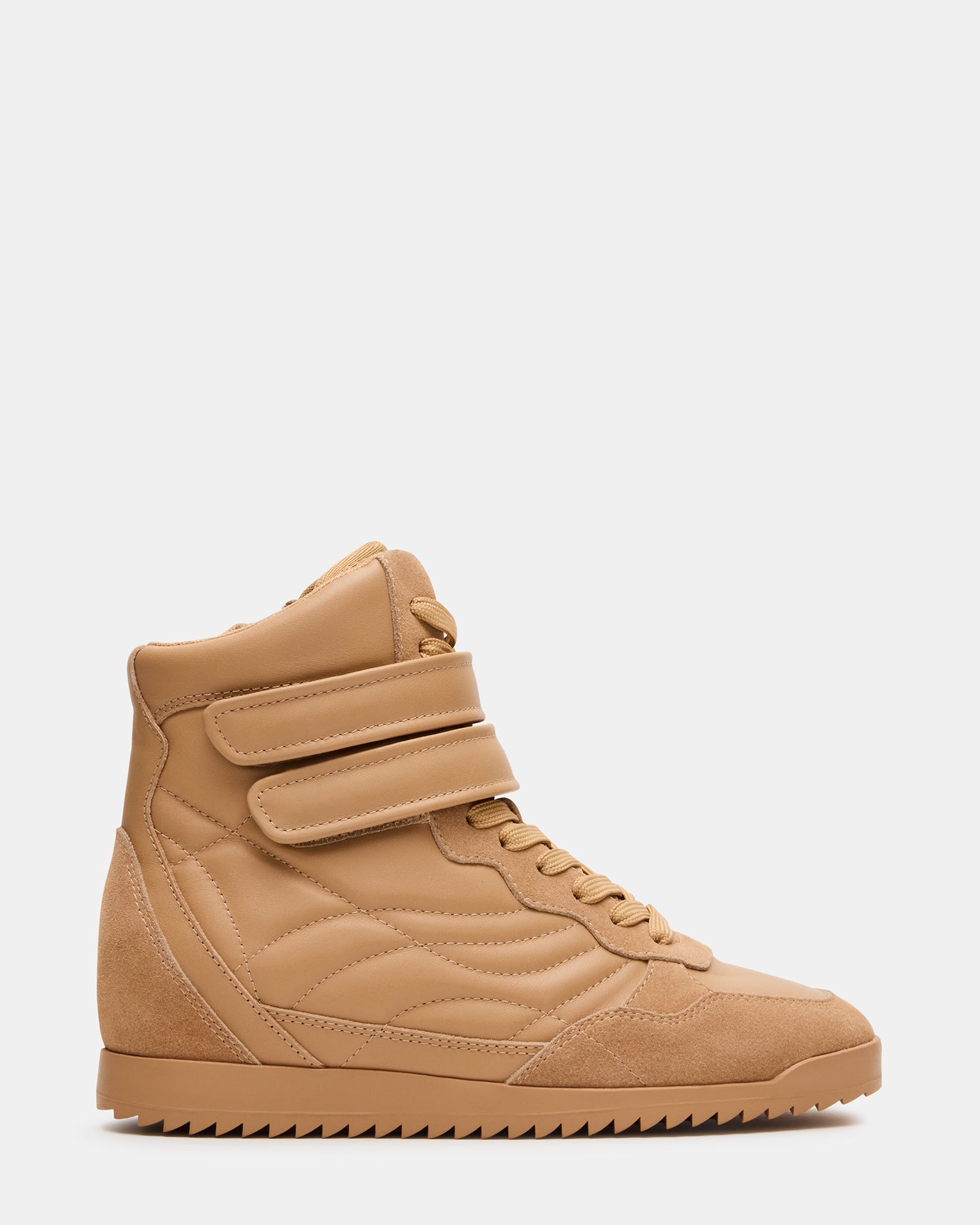Liftoff tan leather high-top sneakers side view on cobblestone