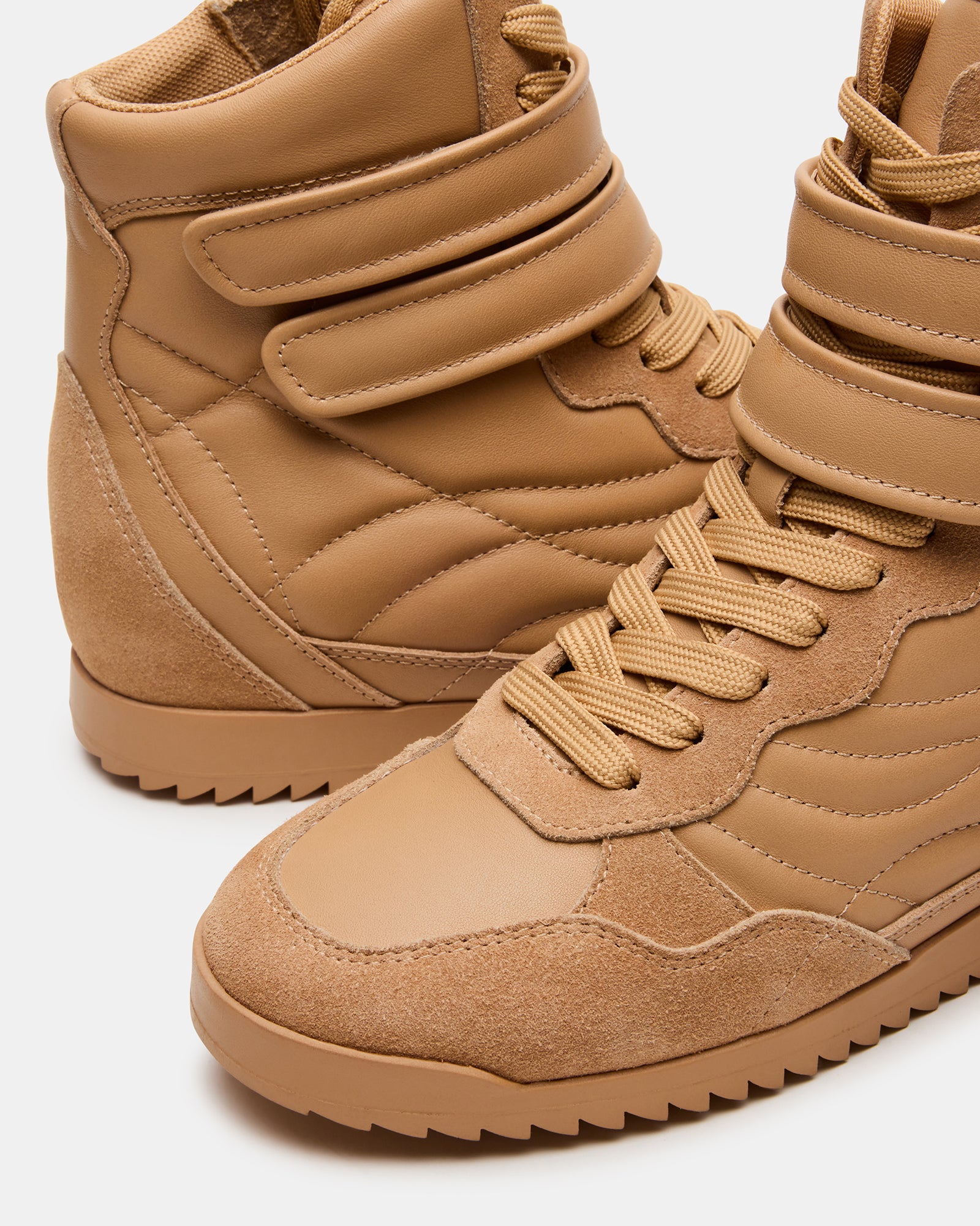 Stylish high-top sneakers paired with casual denim