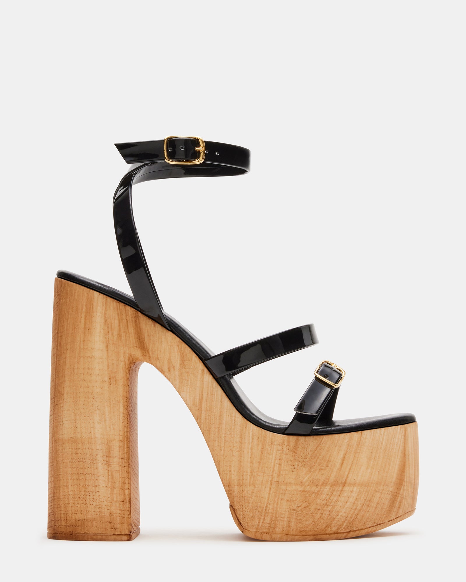 Black patent platform heels with ankle strap and modern design for evening events