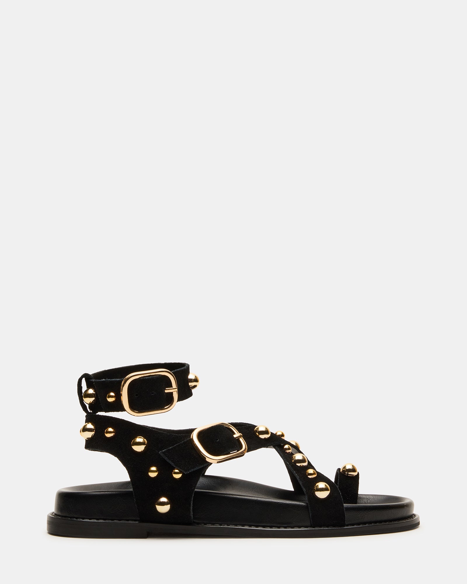 Close-up of black strappy sandals showcasing stud details.