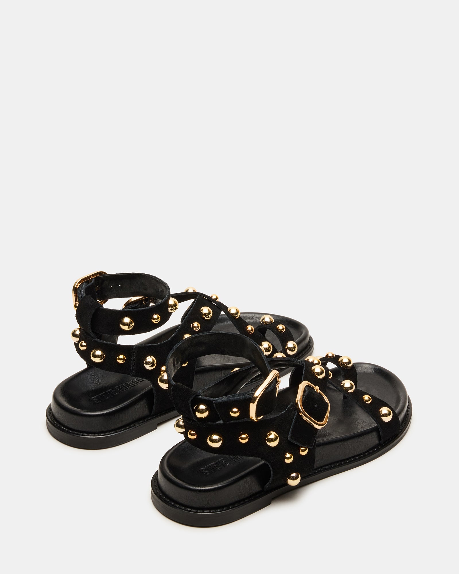 Black platform sandals displayed on a stylish surface.