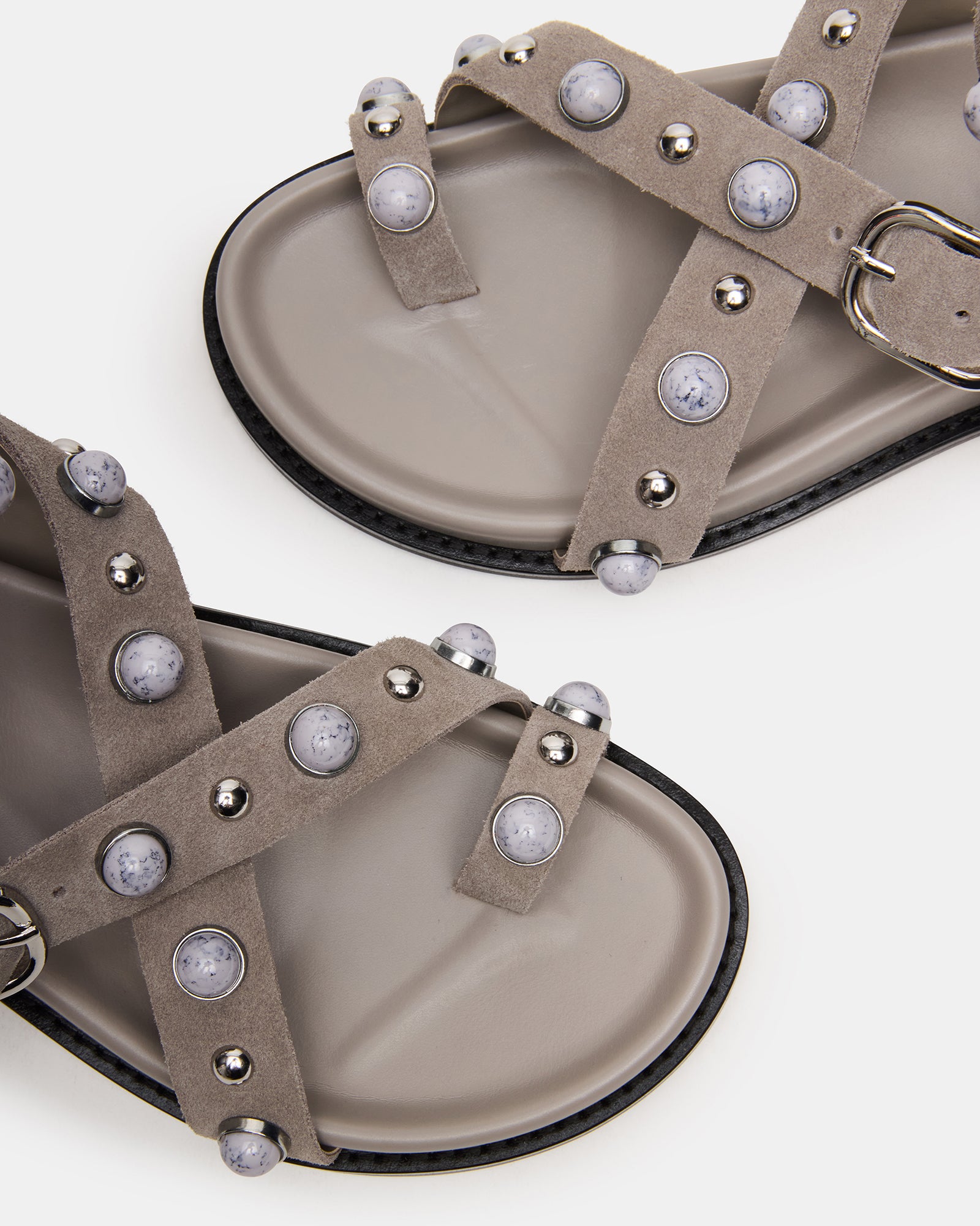 Close-up of Linear Grey Suede Ankle Strap Sandals showing stud hardware.