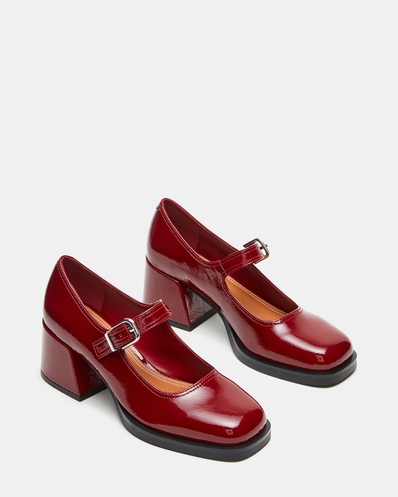 Close-up of womens dress shoes focusing on the synthetic upper material.