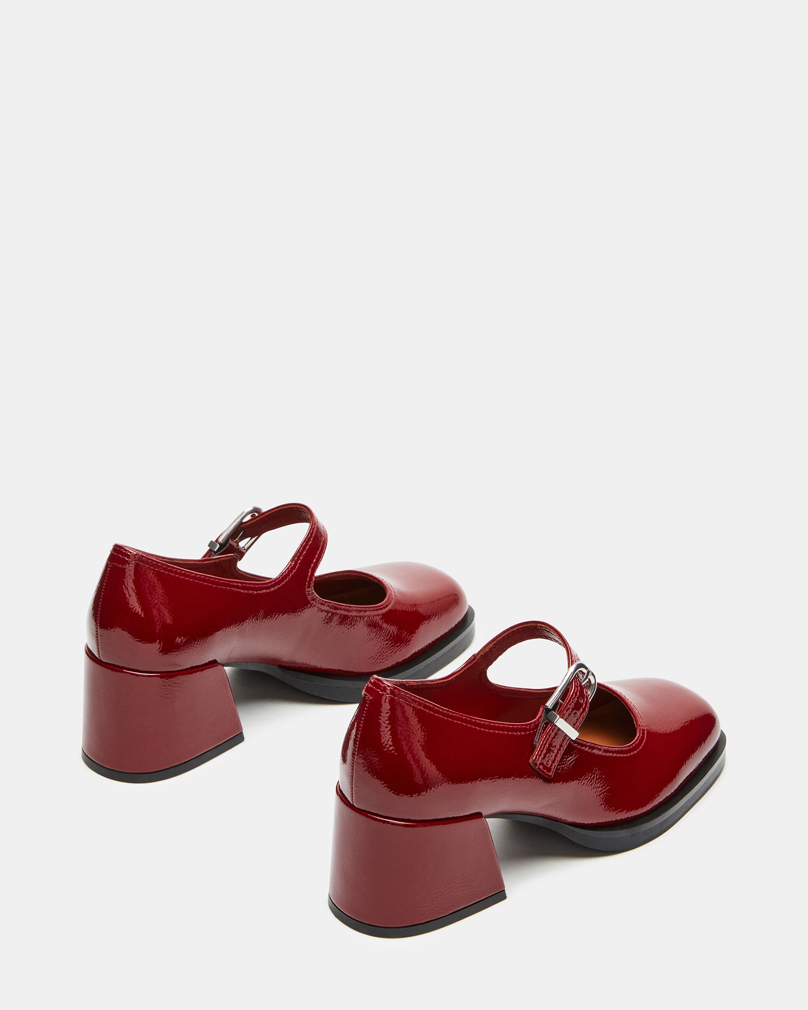 Close-up of womens dress shoes focusing on the synthetic upper material.