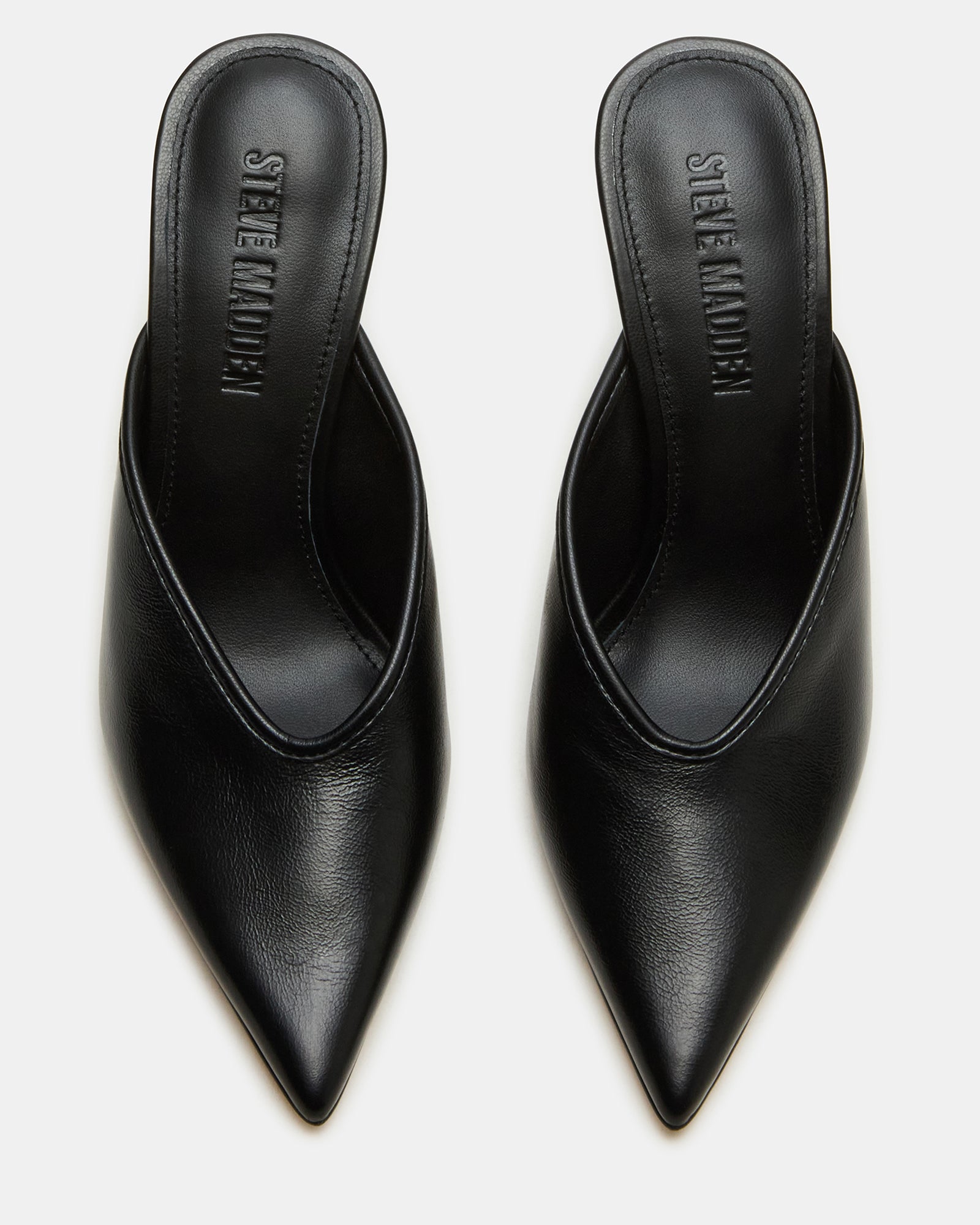 Black leather pointed toe mules showcasing elegant design and 4-inch heels.