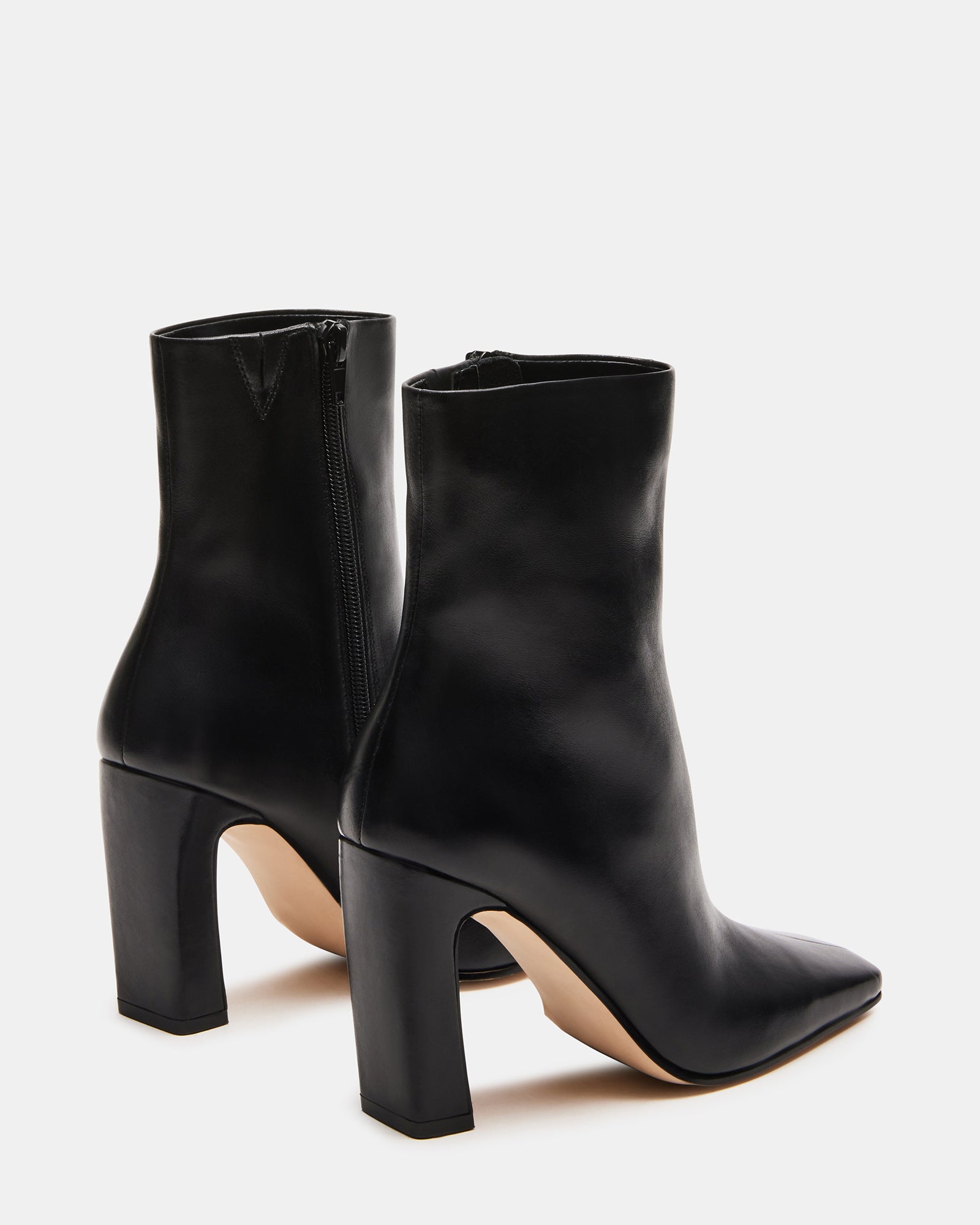 Lifestyle shot featuring UGG ankle boots paired with fall wardrobe essentials.