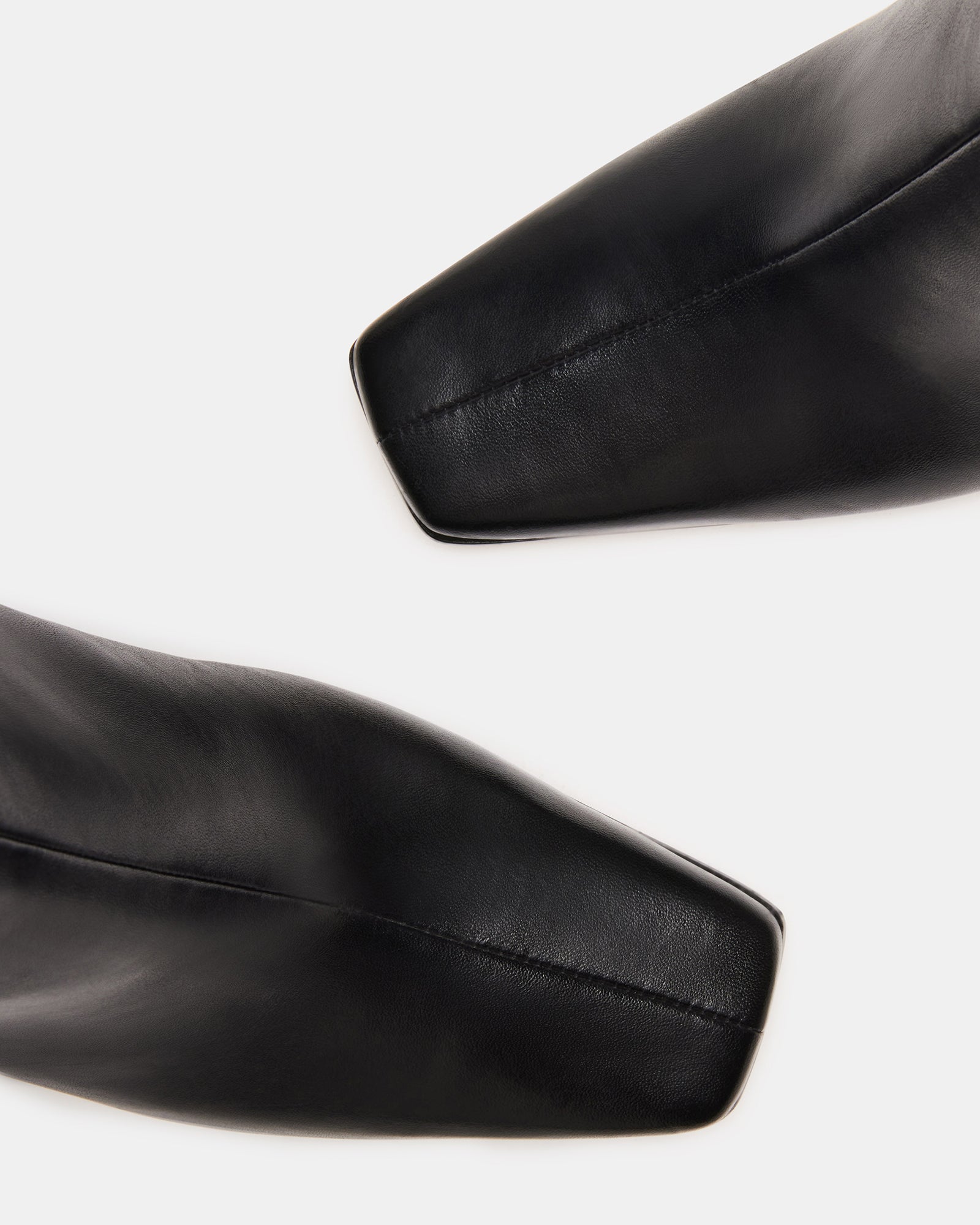 Side angle showing heel height and leather finish of womens ankle boots.