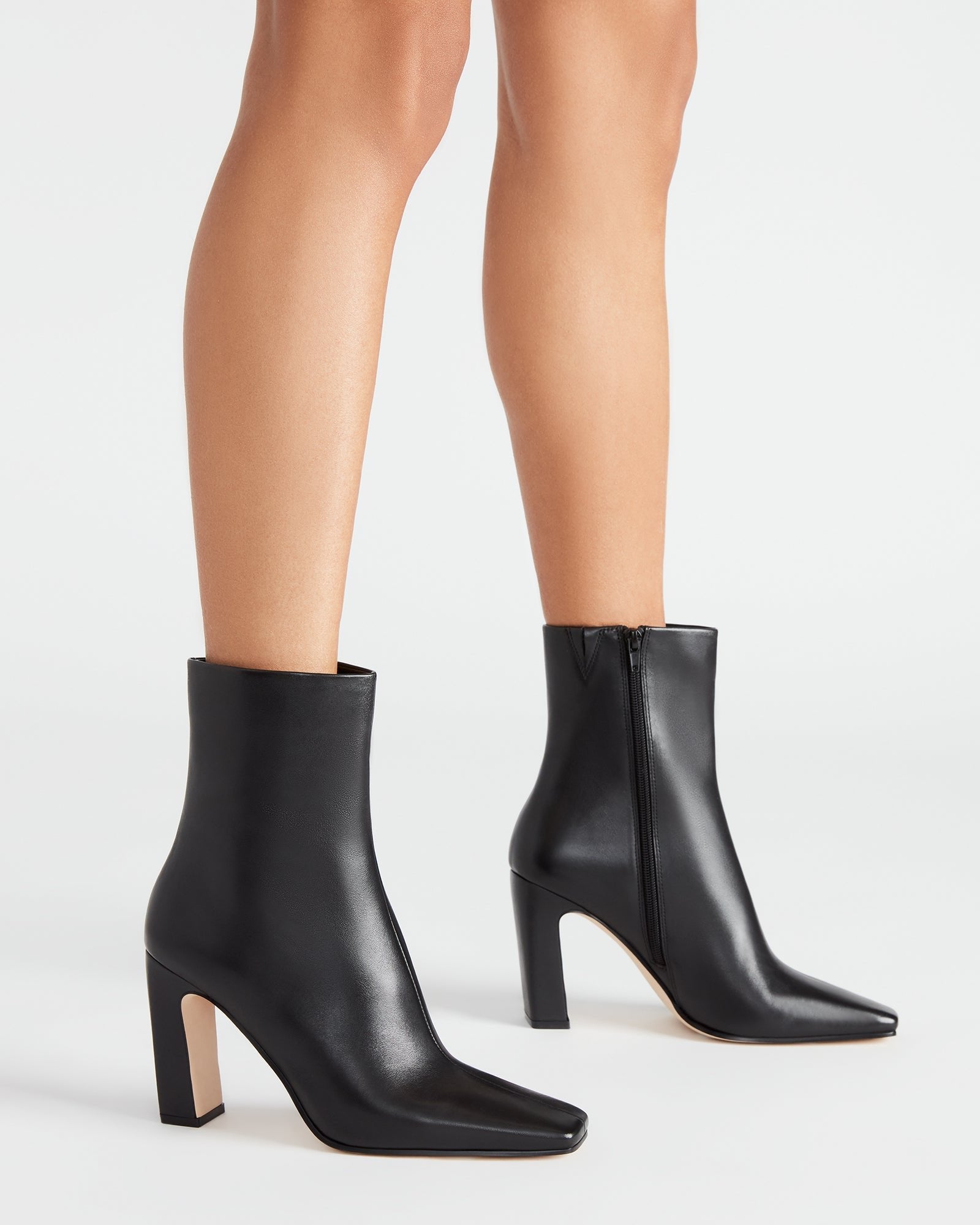Black ankle boots for women styled with denim for an upscale casual look