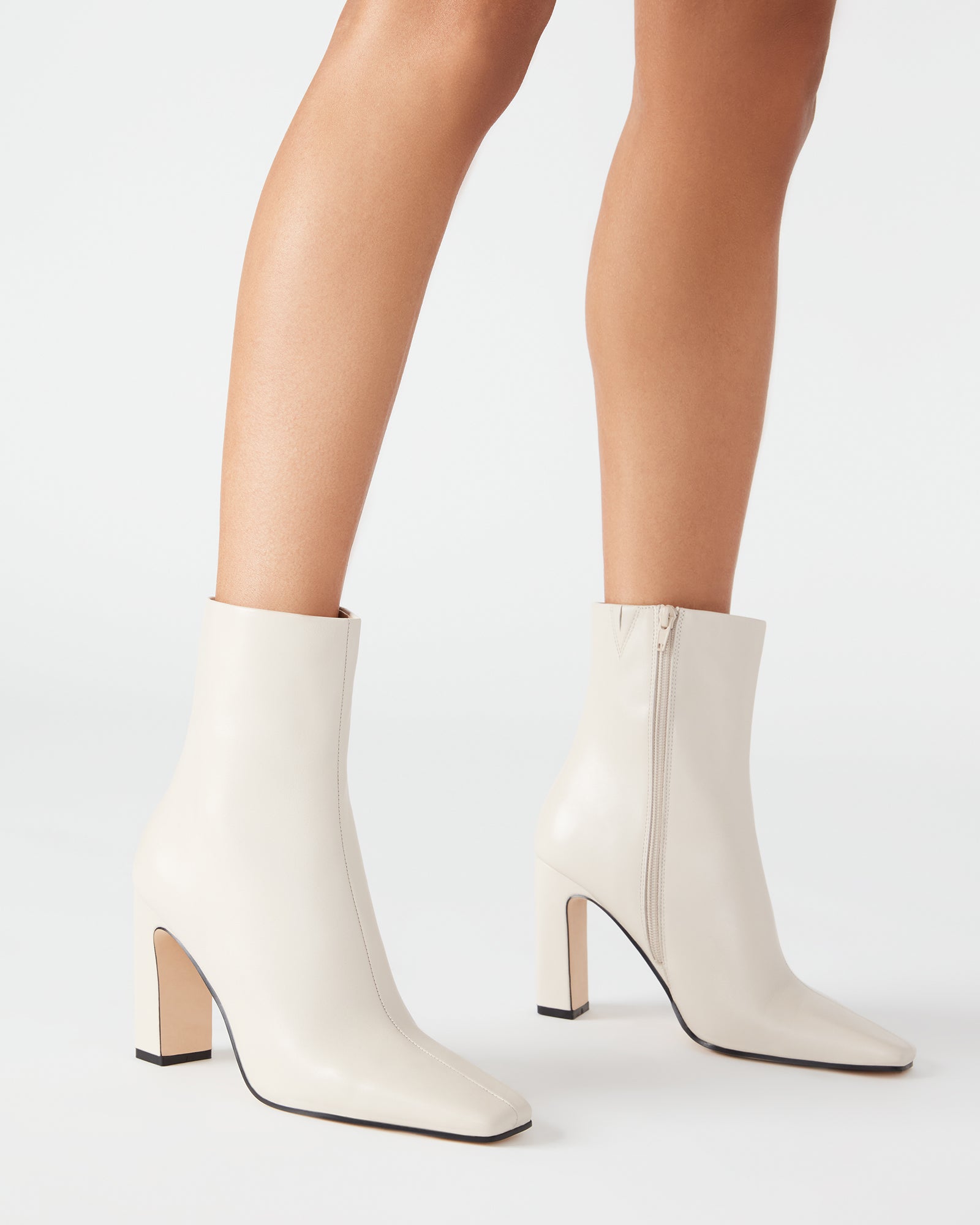Close-up of the square toe design of bone leather booties.
