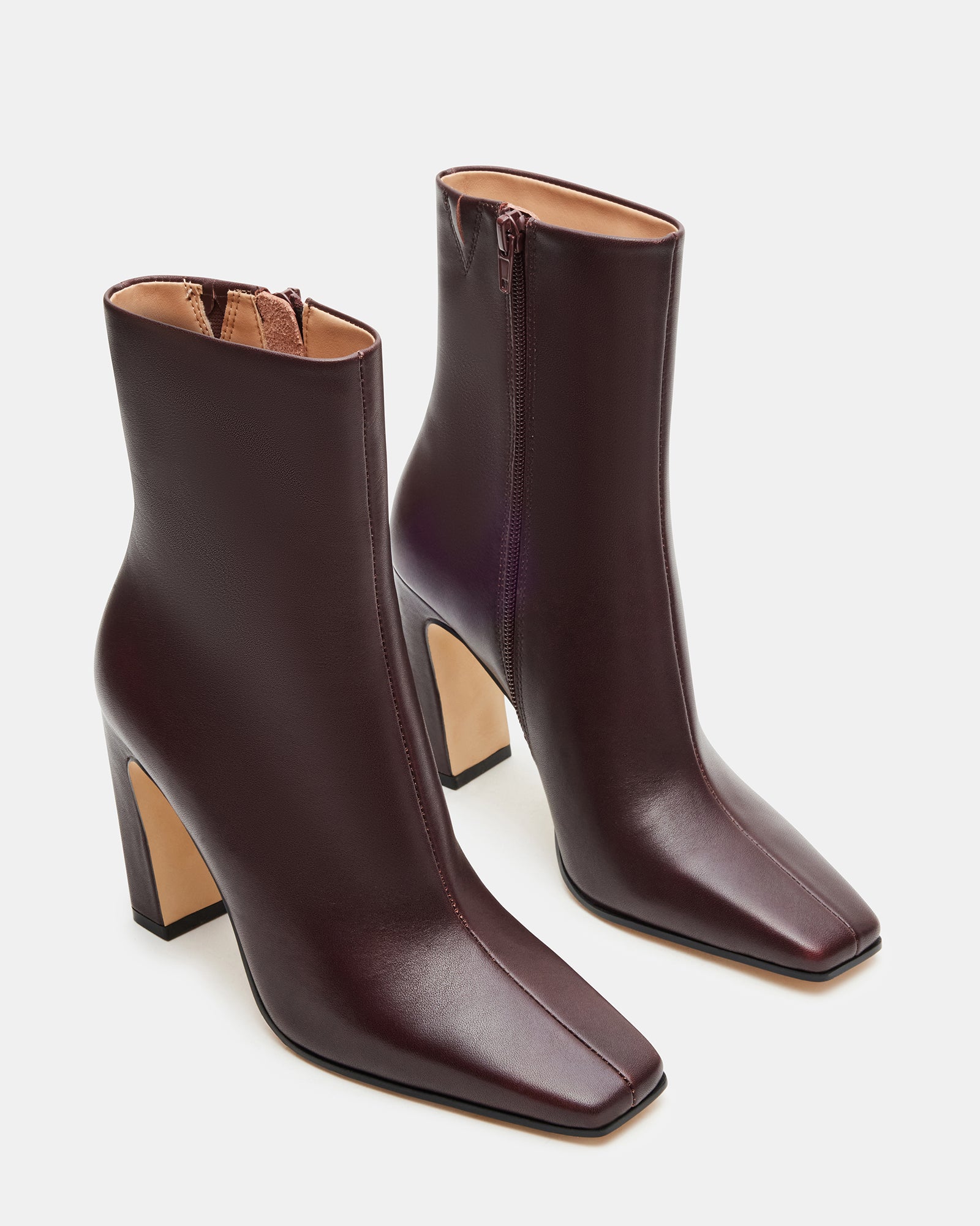 Close-up of leather boots’ stitching and texture, highlighting craftsmanship