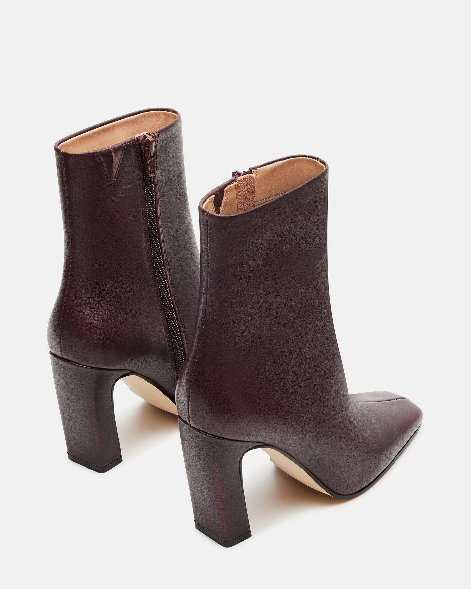 Close-up of leather boots’ stitching and texture, highlighting craftsmanship