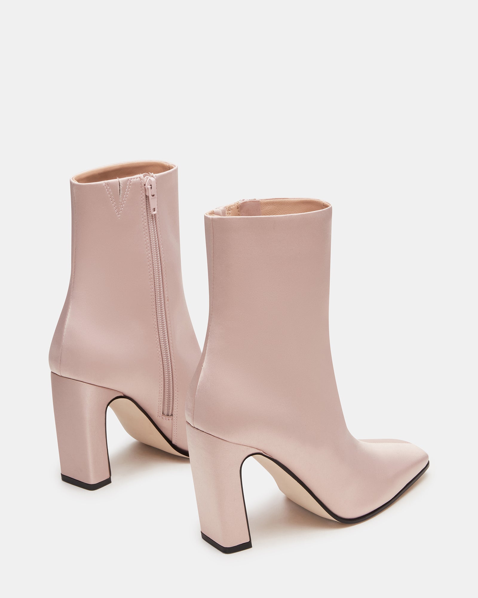 Side profile of fashion booties highlighting heel height and shaft structure