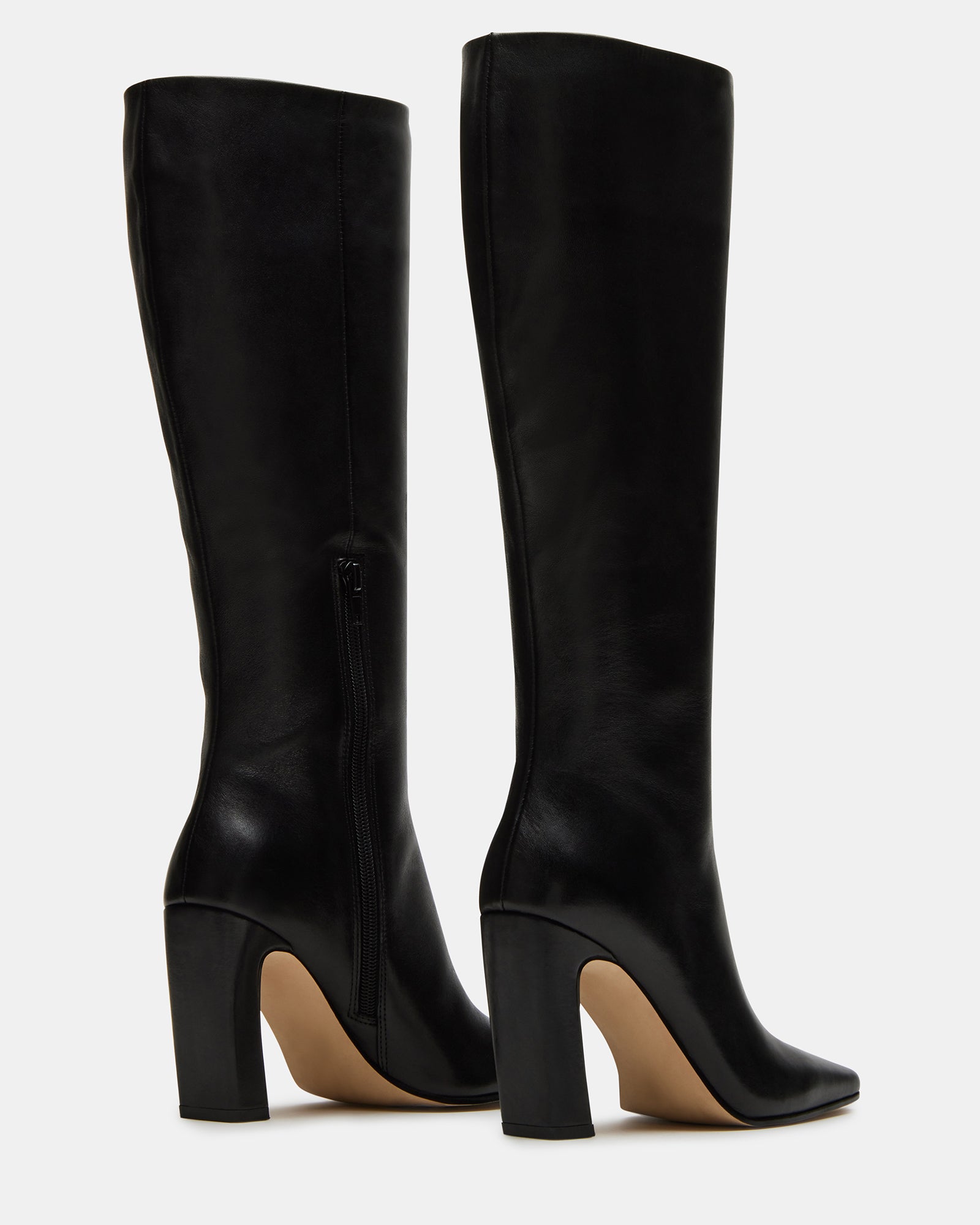 Side profile of the boots showing heel height and shaft fit.