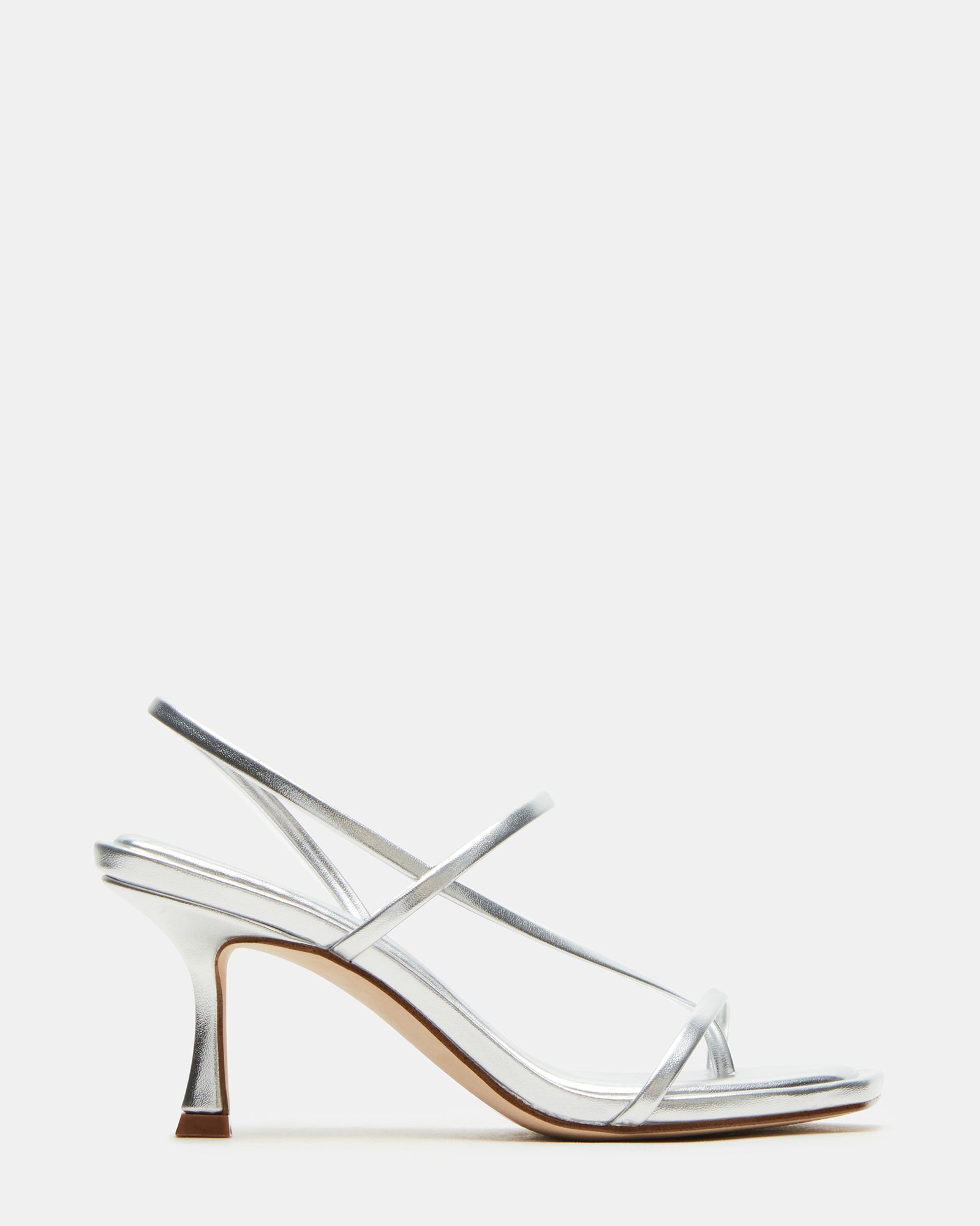 Locke silver square toe heels styled with black tailored pants