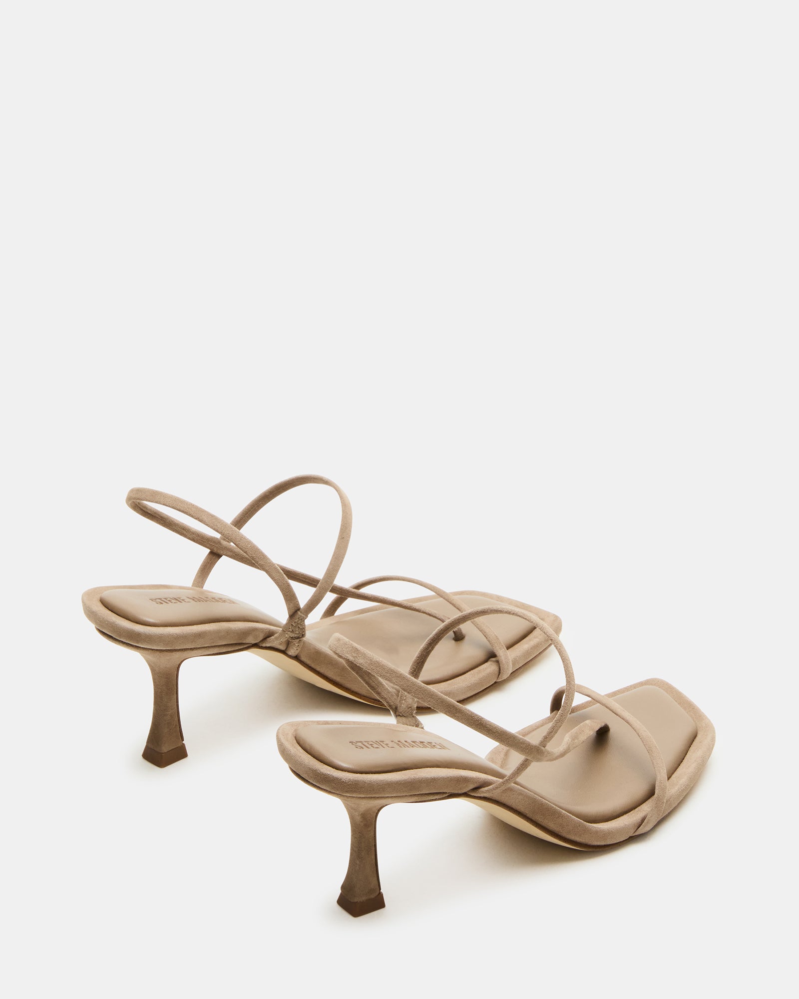 Close-up of the strappy detail on taupe heels, ideal for formal or casual wear