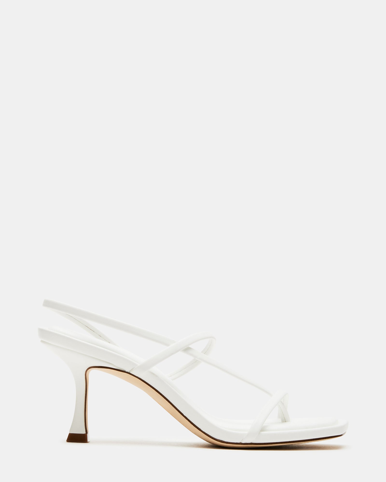 Side view of Locke White heels on hardwood floor, showcasing square toe design