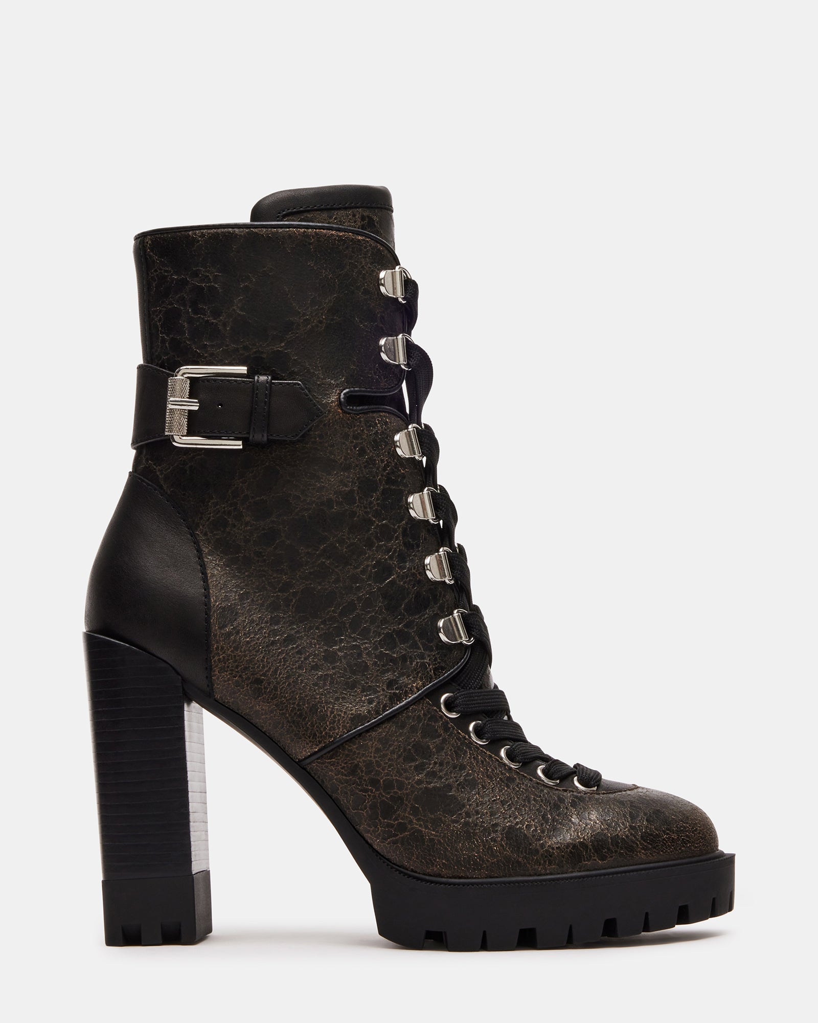 Front-angle view of heeled booties styled with cuffed jeans