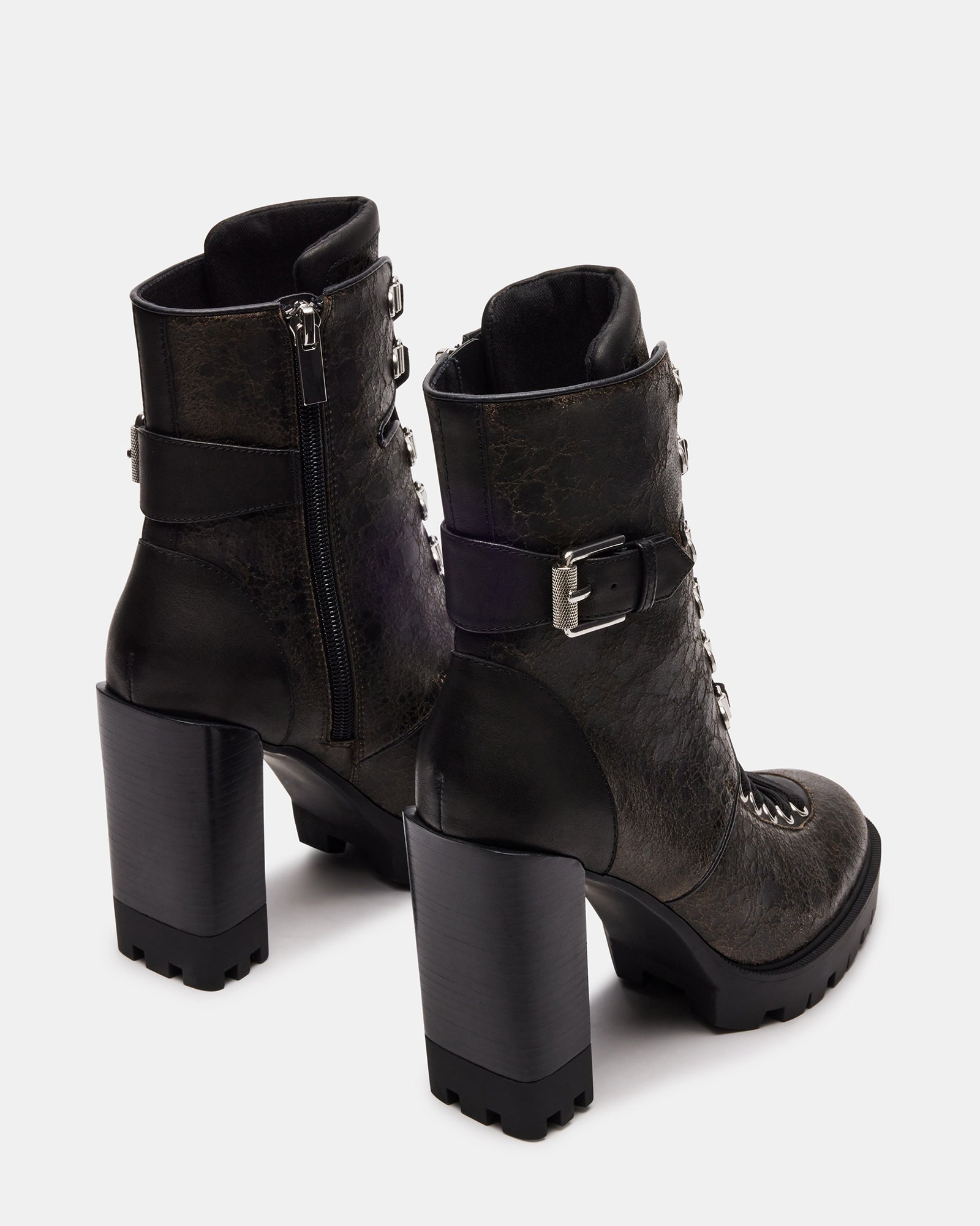 Side profile showing shaft height of black ankle boots
