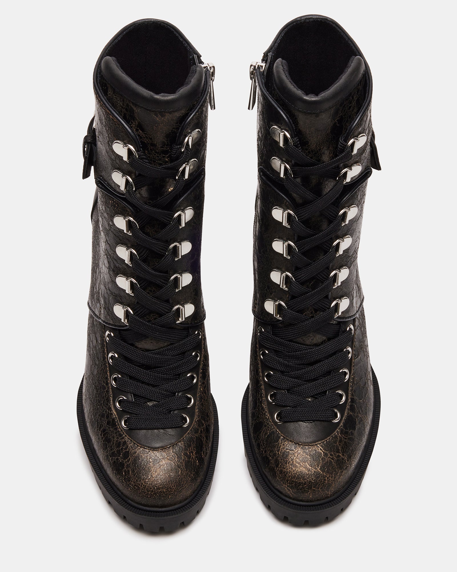 Front-angle view of heeled booties styled with cuffed jeans