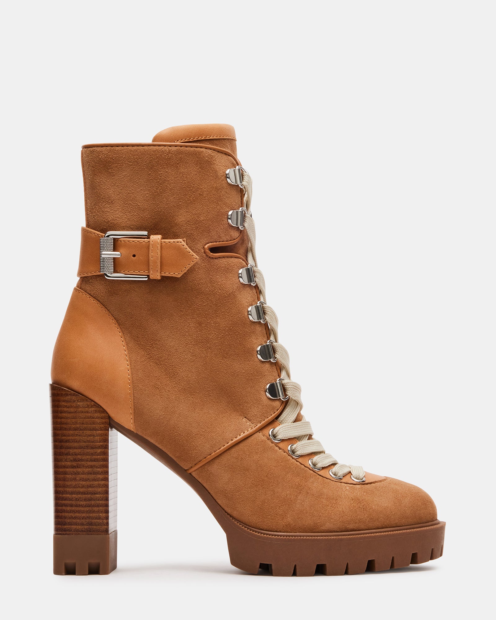 Side view of Londra lace-up heeled ankle booties against a rustic background.