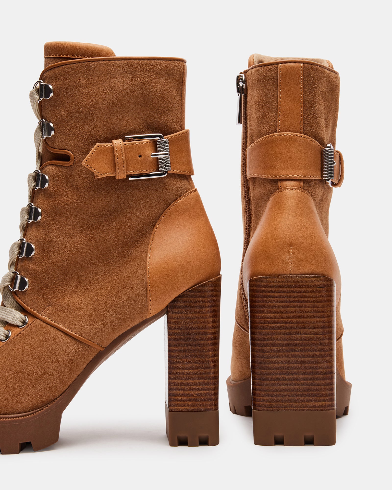 Model wearing Londra womens ankle boots in a chic urban setting.