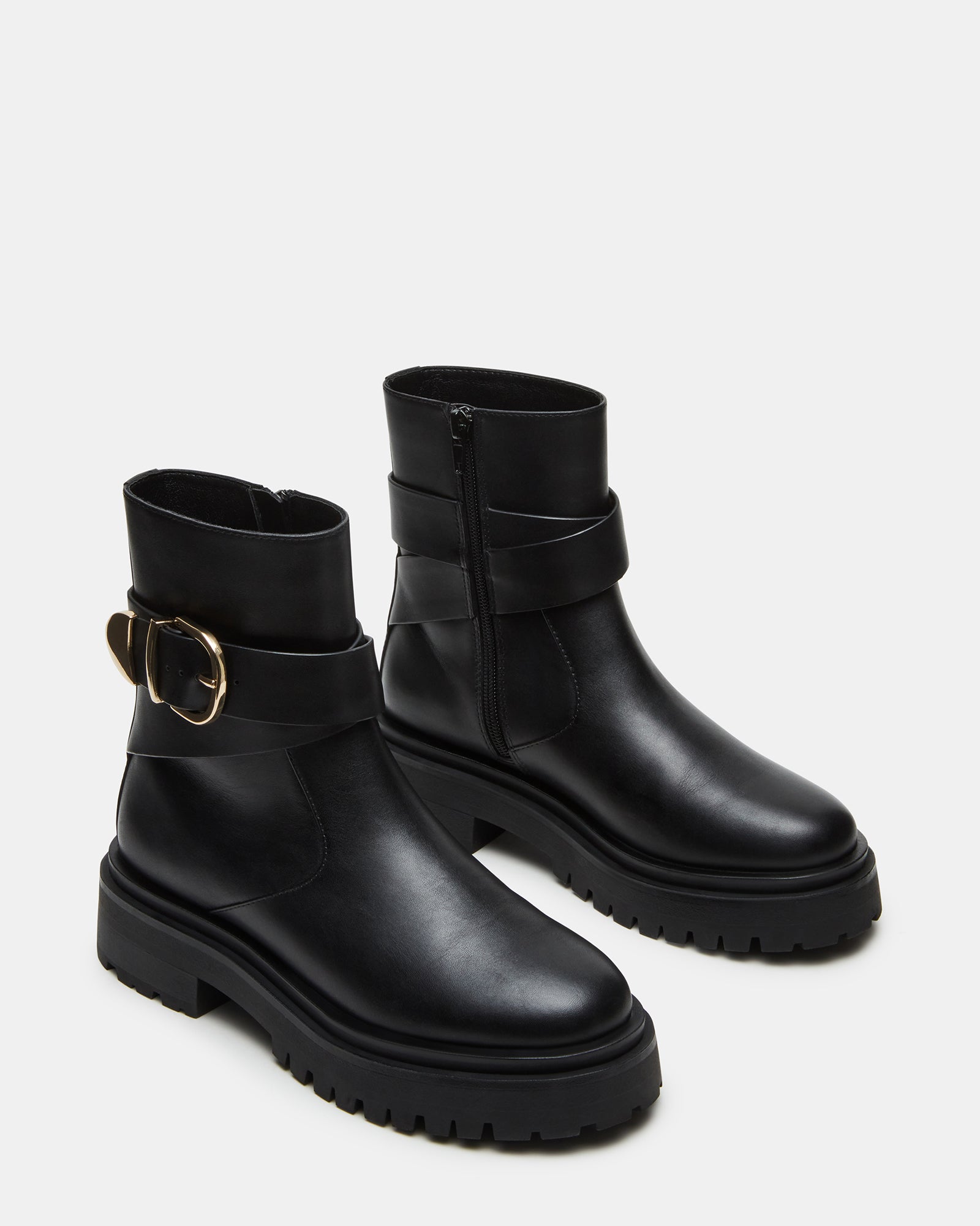 Woman wearing Lonny ankle boots with casual urban outfit.