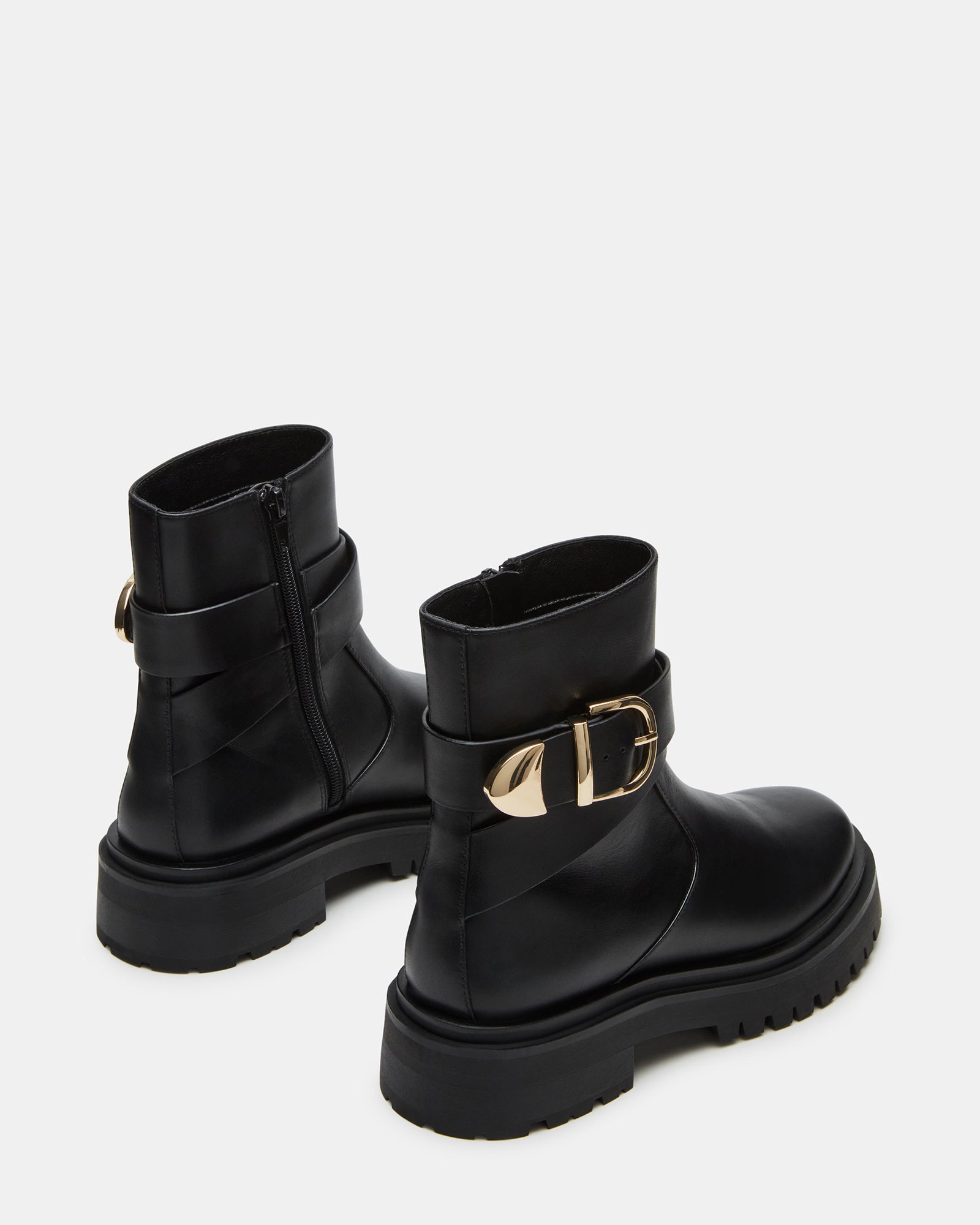 Woman wearing Lonny ankle boots with casual urban outfit.