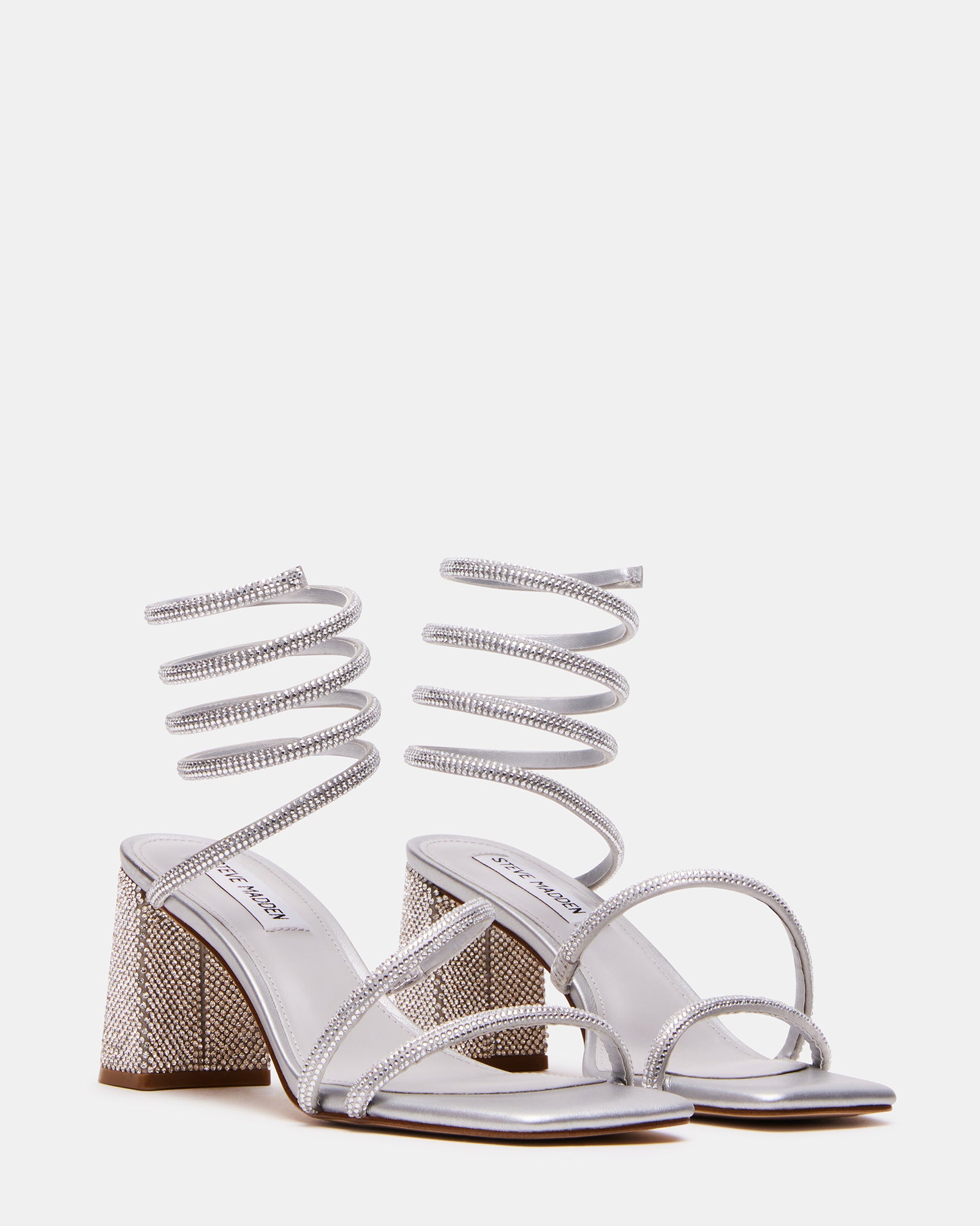 Side view of the gold block heel sandals, highlighting the square toe design.